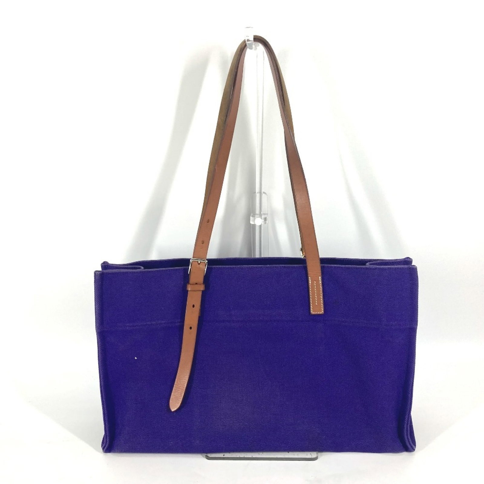 Hermes Shoulder Bag Tote Bag Canvas: Hermes Shoulder Bag Tote Bag Canvas Canvas tote bag from Hermes, featuring a rich purple color and an open pocket for added functionality. Made from high-quality canvas material, this shoulder bag