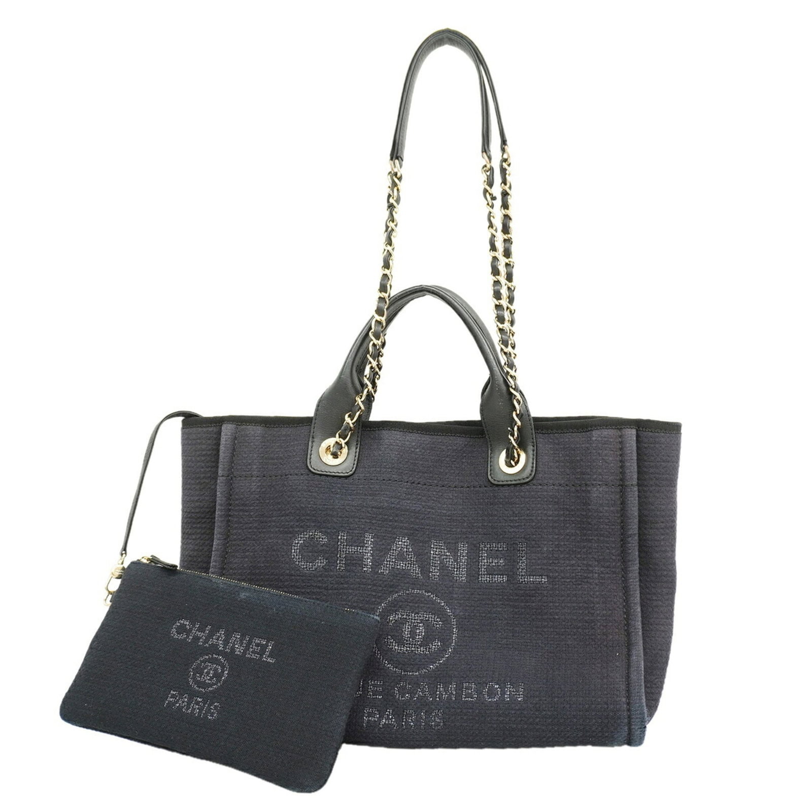 Canvas tote bag by Chanel: Canvas tote bag by Chanel Canvas tote bag by Chanel, featuring a sleek black canvas construction and champagne gold hardware, adds a touch of timeless elegance to any outfit. Measuring 26cm x 34cm x