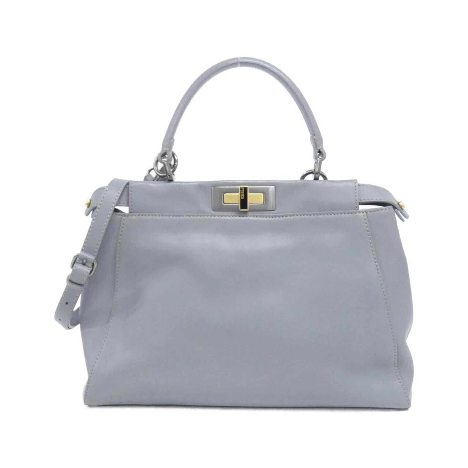 Handbag Leather Fendi: Handbag Leather Fendi The Fendi MPN 8BN226 handbag is a stylish leather bag with a gray color and gold hardware, measuring 24cm x 34cm x 11cm. It comes with a dust bag and shoulder strap, making it a