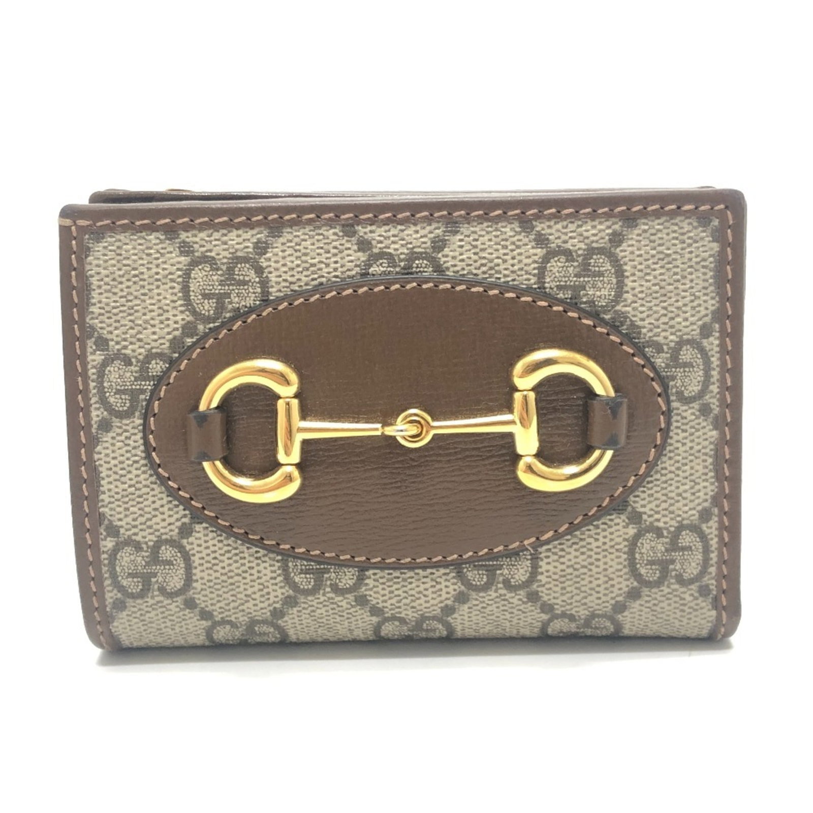 Gg Supreme Gg Bi Fold Wallet: Gg Supreme Gg Bi Fold Wallet Gucci's GG Supreme bi-fold wallet boasts a sleek, brown design with a sophisticated GG Supreme pattern. Made from high-quality materials, this wallet measures 8.5cm x 11.5