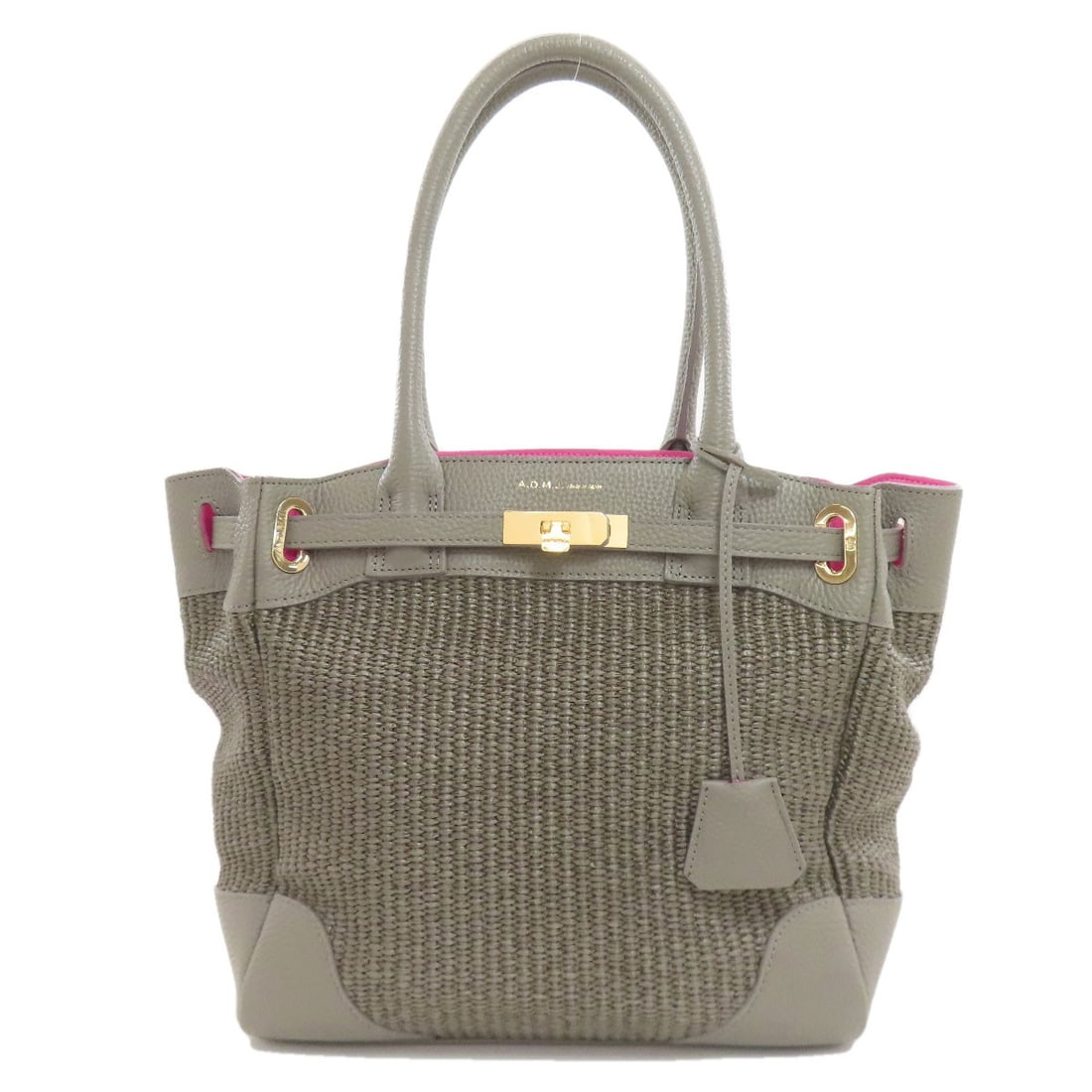 Leather Tote Bag Admj Logo: Leather Tote Bag Admj Logo Gray leather tote bag with the ADMJ logo. Made from high-quality leather, this bag features a classic design and a neutral gray color. The ADMJ logo adds a touch of