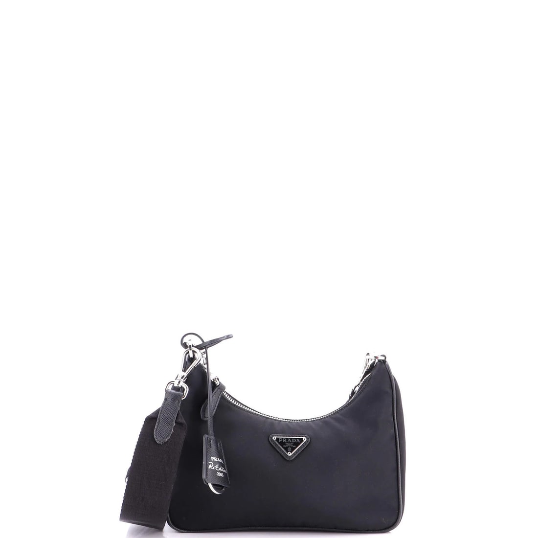 Re Edition Small Prada 2005 Bag Tessuto Shoulder: Re Edition Small Prada 2005 Bag Tessuto Shoulder Small Re Edition Prada 2005 Bag in Black Nylon, featuring a cross body design with a tessuto interior and silver hardware. This 2005 re-edition Prada s