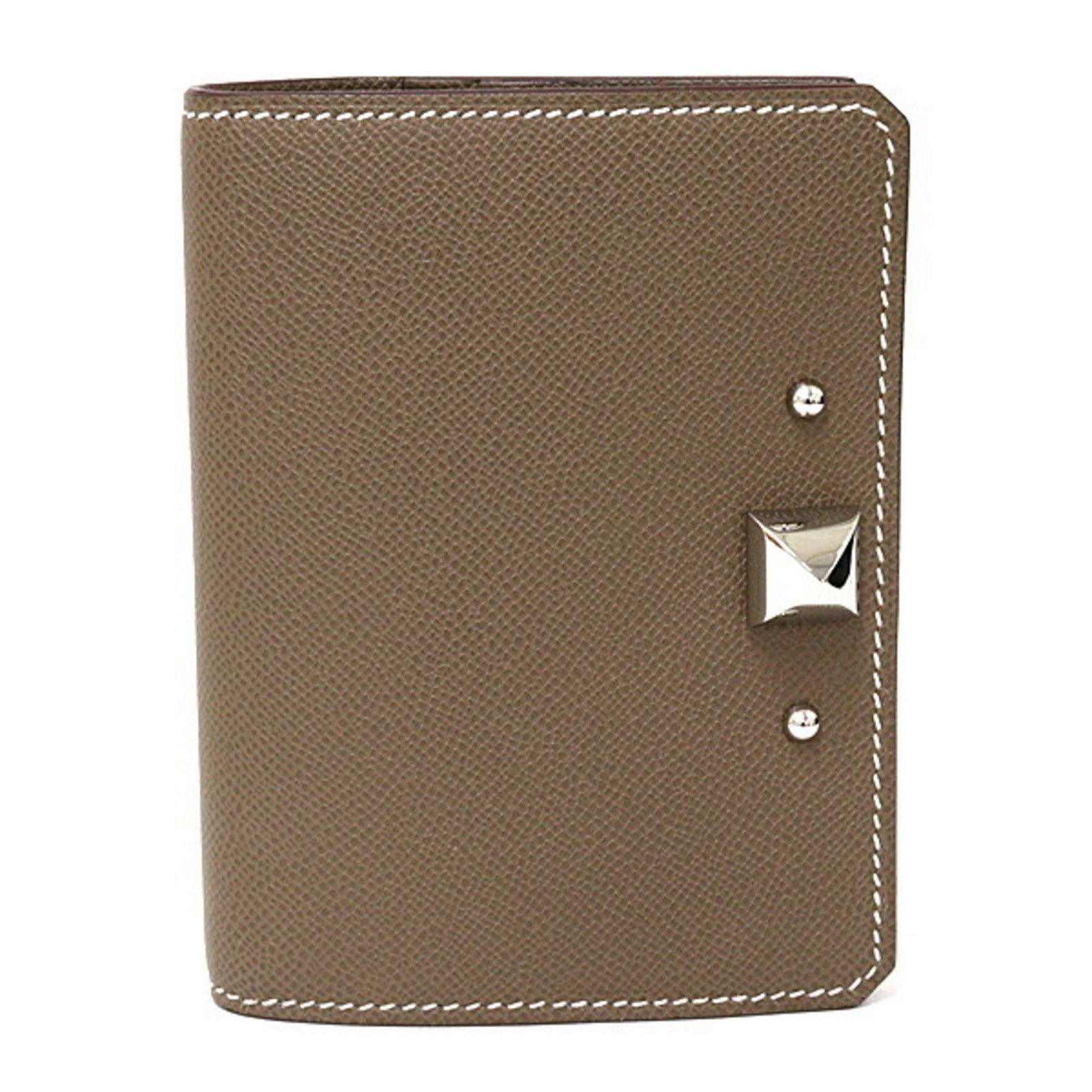 Card case Hermes: Card case Hermes Etoupe gray Card case from Hermes, crafted in France, features a sleek 8cm x 10.5cm x 1.8cm design. The subtle color and compact size make it a versatile accessory for everyday use.