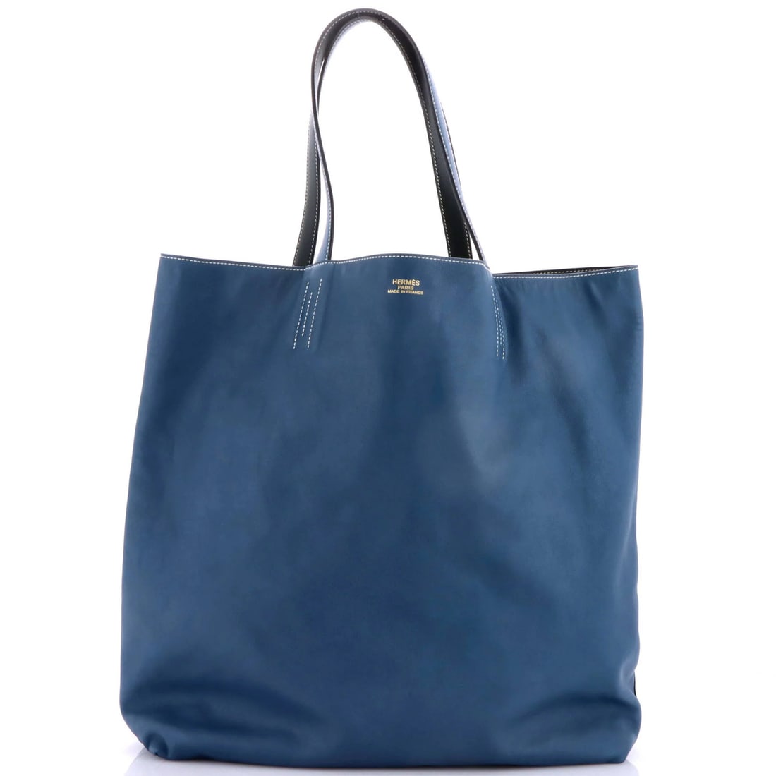 Double Sens Tote Veau Hermes Sikkim: Double Sens Tote Veau Hermes Sikkim The Double Sens Tote Veau Sikkim 45 from Hermes boasts a sleek blue leather exterior and a spacious interior with a vibrant green lining. This stylish shoulder bag