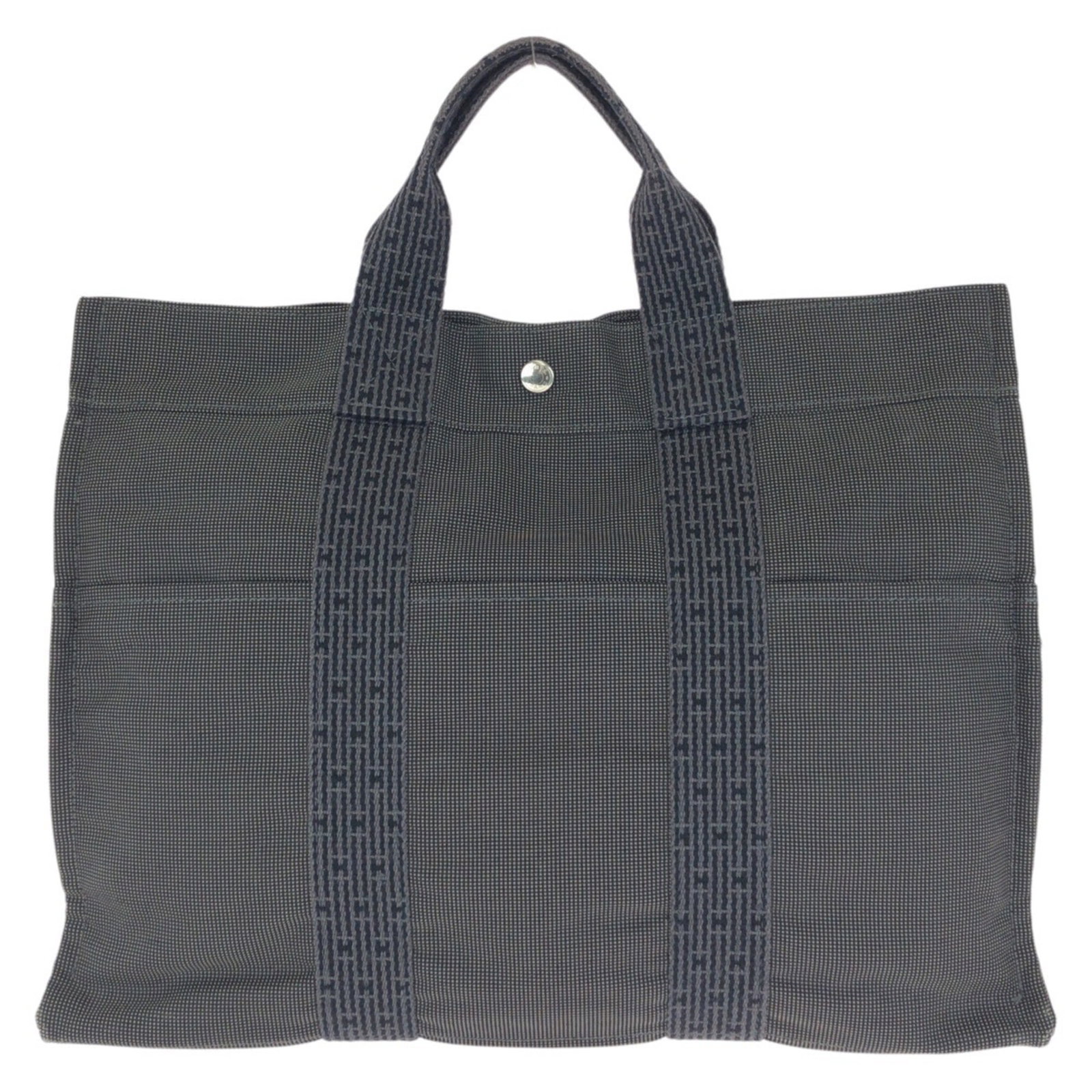 Polyamide Polyester Bag Tote Handbag Hermes: Polyamide Polyester Bag Tote Handbag Hermes Polyamide and Polyester Handbag from Hermes, a French luxury brand, boasts a sturdy design with a gray color. Made from durable materials, this tote bag mea
