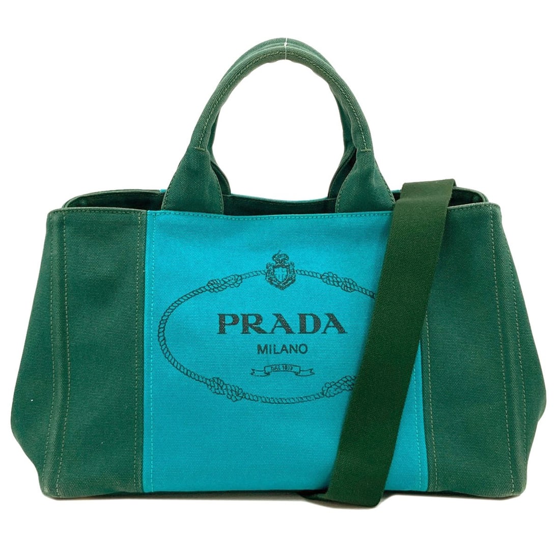 Canapa Handbag Canvas 2Way Prada: Canapa Handbag Canvas 2Way Prada Canvas 2Way Prada Handbag in Green. This green handbag features a canvas exterior and boasts a 2-way design. The green color adds a pop of style to any outfit. Item