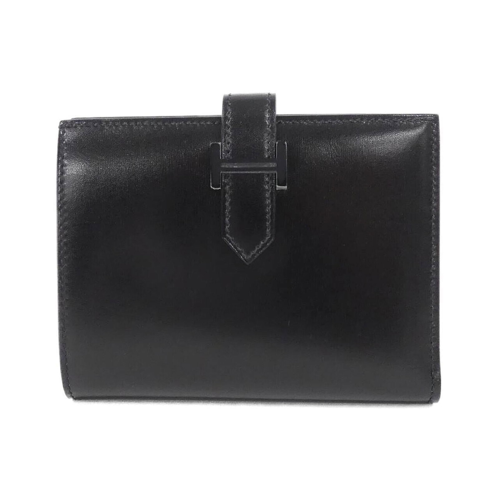 Calf leather box bi-fold wallet Hermes: Calf leather box bi-fold wallet Hermes Box calf leather bi-fold wallet from Hermes, featuring a sleek black design with a compact 9.5cm x 12cm x 2cm size. Made from high-quality box calf leather, this