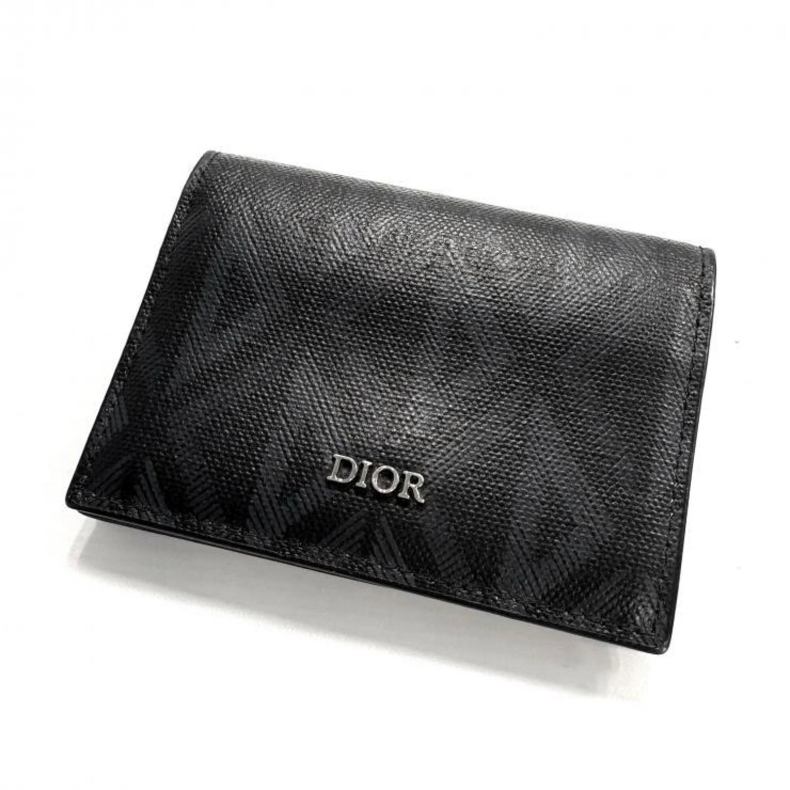 Card Case By Christian Dior: Card Case By Christian Dior The Card Case by Christian Dior is a sleek and sophisticated accessory, measuring 7.5cm x 10cm x 1.3cm. Its black color and compact size make it a versatile and practical