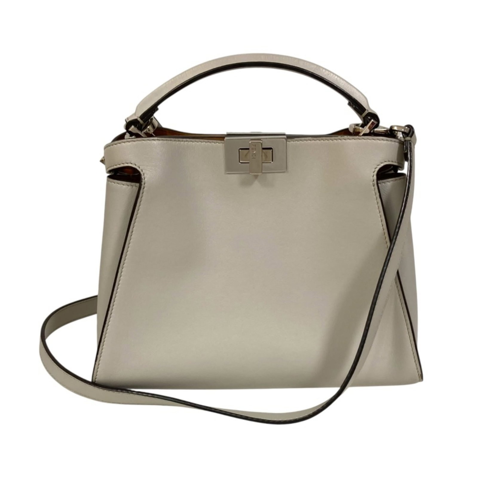 Fendi Handbag Shoulder: Fendi Handbag Shoulder The Fendi Peekaboo Shoulder Bag is a sleek and sophisticated accessory, characterized by its distinctive turn-lock closure and spacious interior. Measuring 21cm x 23cm x