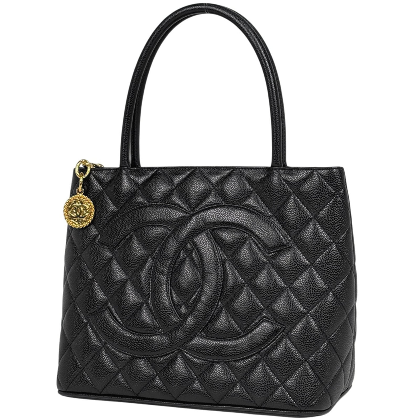 Calfskin Handbag Chanel: Calfskin Handbag Chanel Calfskin Handbag in Black from Chanel. This 24cm x 29cm x 15cm handbag features grained calfskin material and a sleek, black design. Made with high-quality materials, it