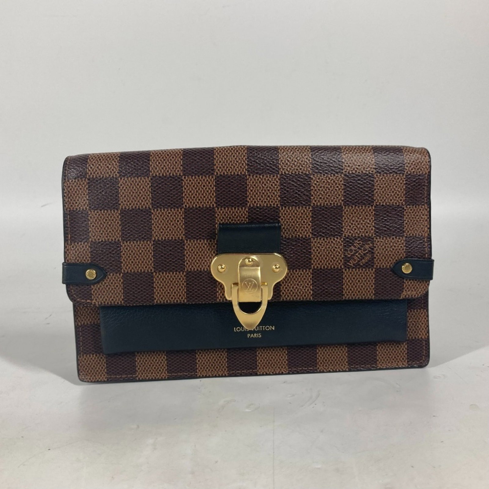 Shoulder Bag Damier Canvas By Louis Vuitton: Shoulder Bag Damier Canvas By Louis Vuitton Black and Brown Damier Canvas Shoulder Bag by Louis Vuitton. This shoulder bag features the iconic Damier Canvas material, a classic design element of the