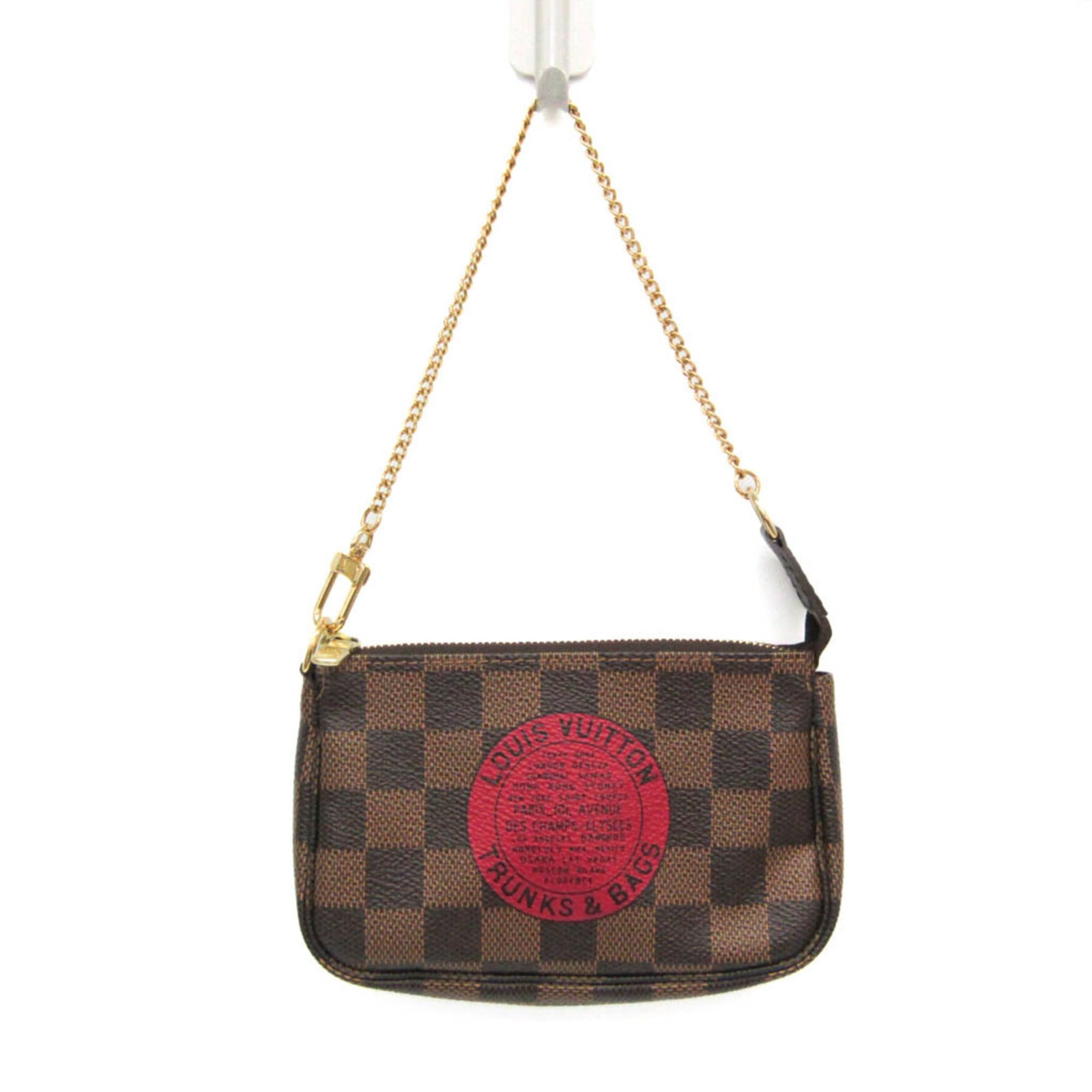 Damier Canvas Handbag Louis Vuitton: Damier Canvas Handbag Louis Vuitton Damier Canvas Mini Pochette Handbag from Louis Vuitton features a unique Damier pattern on Ebene-colored canvas, secured with a zipper closure. Measuring 9.5cm x