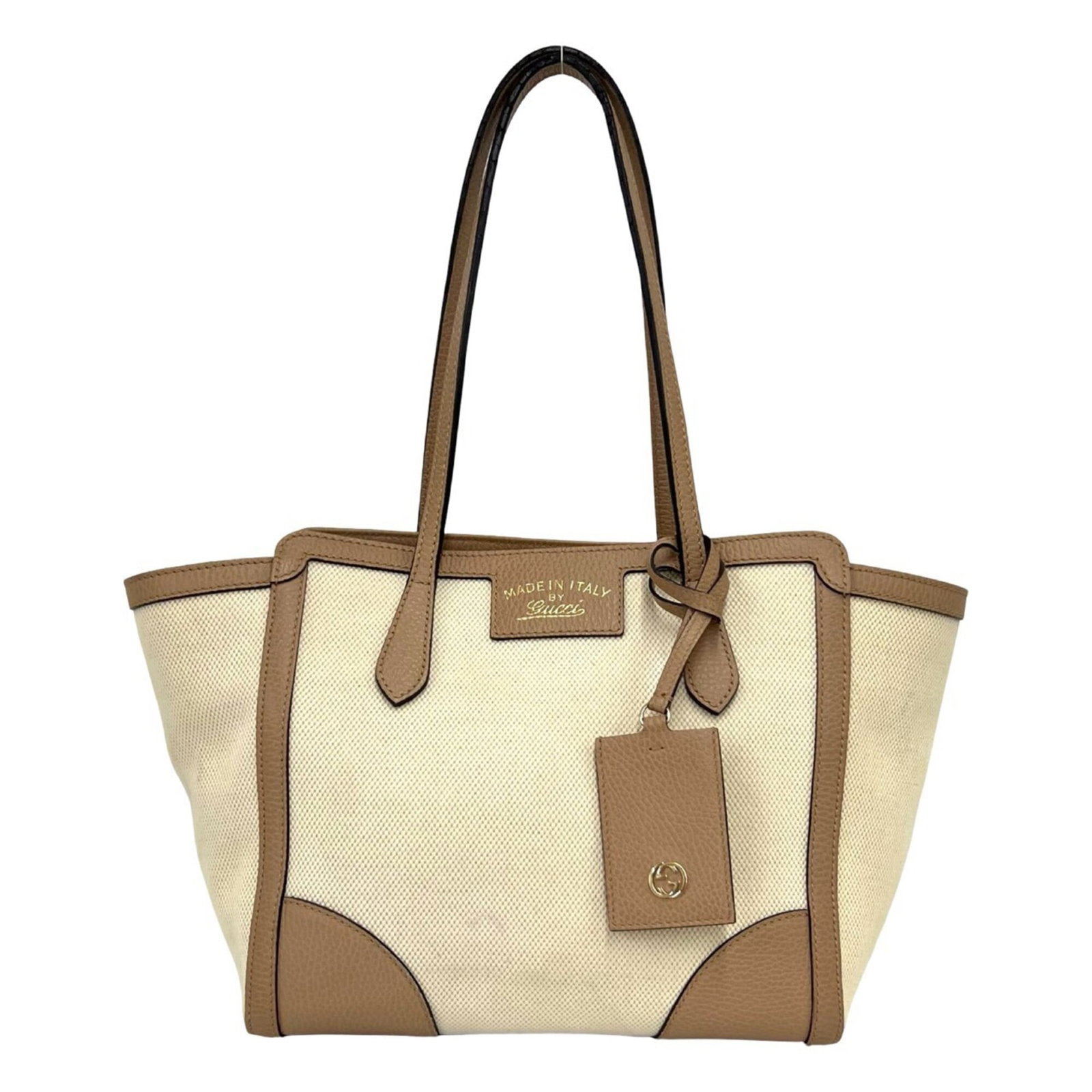 Canvas Leather Tote Bag Gucci: Canvas Leather Tote Bag Gucci Canvas Leather Tote Bag Gucci is a stylish and functional tote bag made from canvas and leather. The beige and brown color combination adds a touch of sophistication to