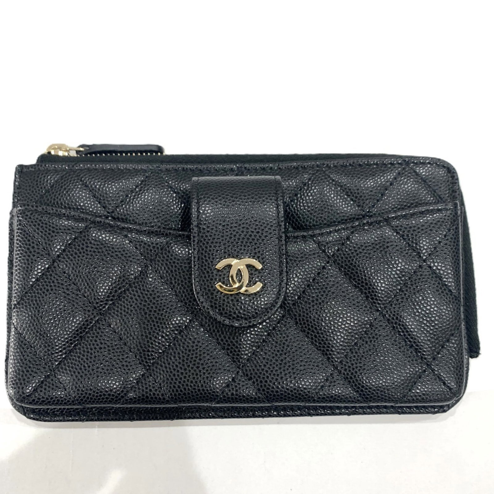 Calfskin Pouch Grained Chanel: Calfskin Pouch Grained Chanel Calfskin Pouch Grained Chanel is a black, women's pouch made from high-quality Grained Calfskin. Measuring 9.5cm x 17cm x 2cm, it features a sleek design that showcases
