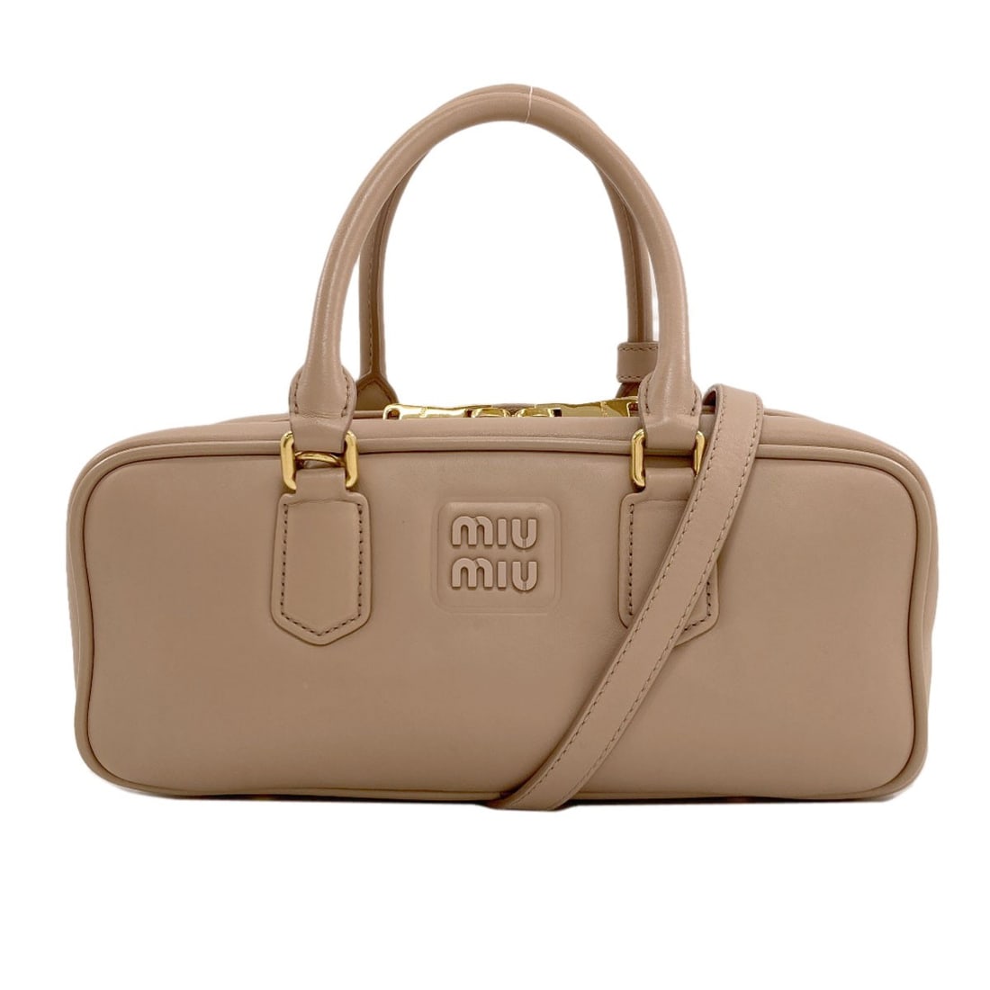 Leather Large Miumiu Arkady Handbag: Leather Large Miumiu Arkady Handbag Beige leather makes this large Miumiu Arkady handbag a stylish and versatile accessory. The exterior features a high-quality leather material, while the beige color
