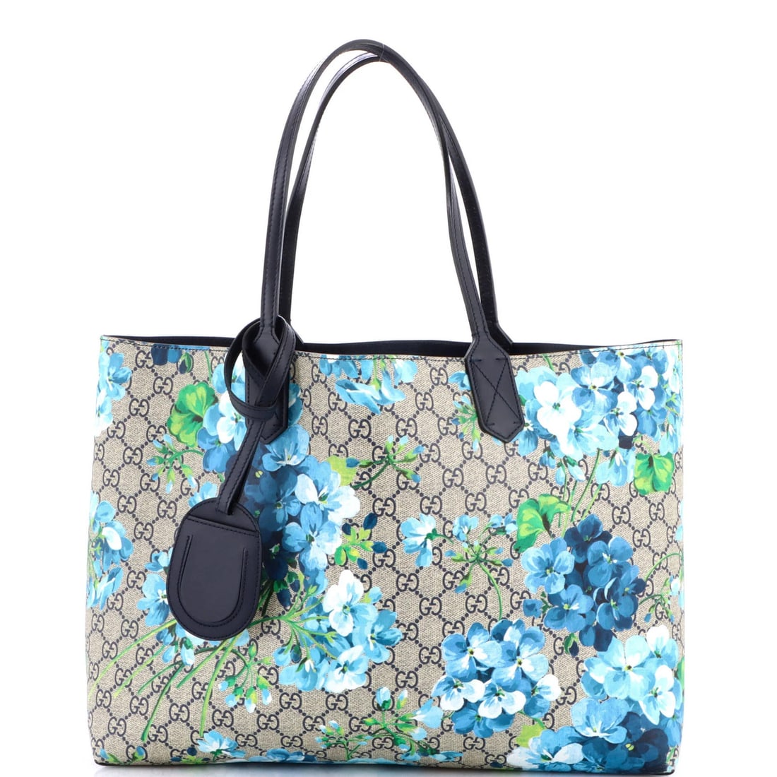 Tote Reversible Blooms GG Print Leather Medium Gucci: Tote Reversible Blooms GG Print Leather Medium Gucci Medium Gucci Reversible Tote with Blooms GG Print Leather in Brown, featuring a reversible design and heavy-duty leather construction. The exterior