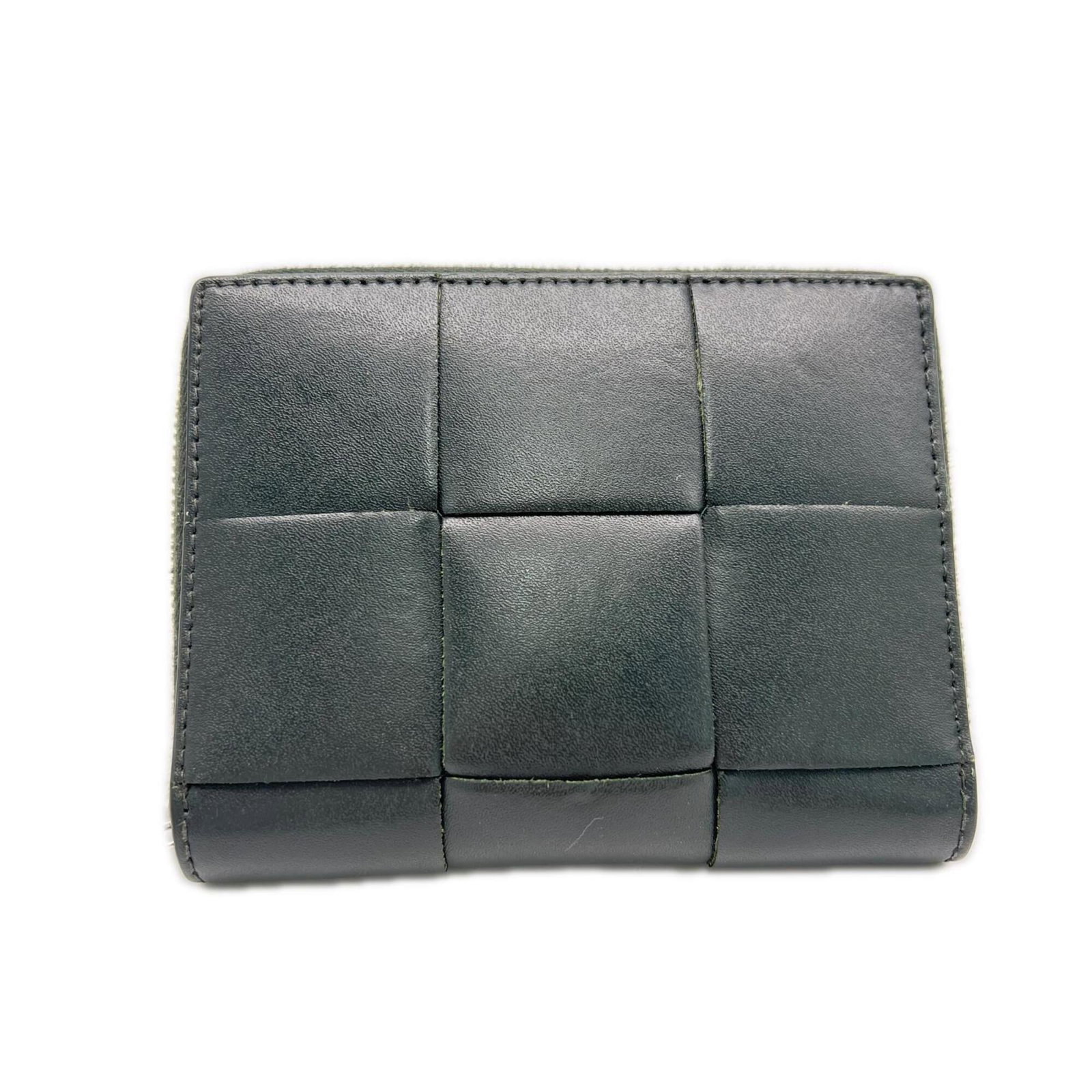 Bottega Veneta Wallet (Bi-Fold): Bottega Veneta Wallet (Bi-Fold) Dark green Bottega Veneta bi-fold wallet with clean lines and a classic design. Measuring 9.5cm x 12cm x 1.5cm, this wallet is made with a sturdy material and features 
