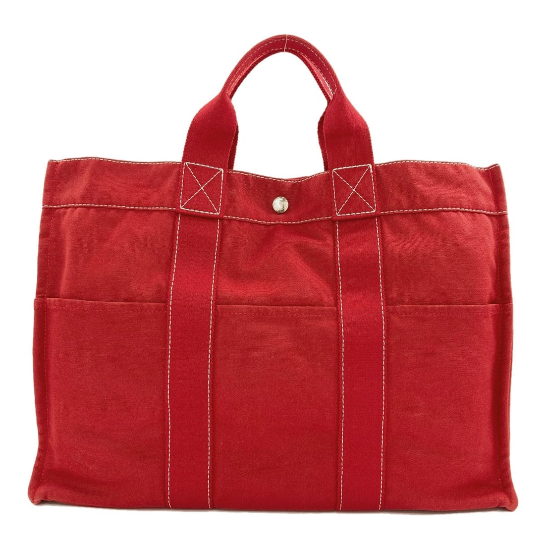 Canvas tote bag by Hermes: Canvas tote bag by Hermes Red canvas tote bag by Hermes, featuring a classic style and a bold exterior color. The bag measures 12.2 inches in height and 16.9 inches in width, with a 3.9 inch depth and