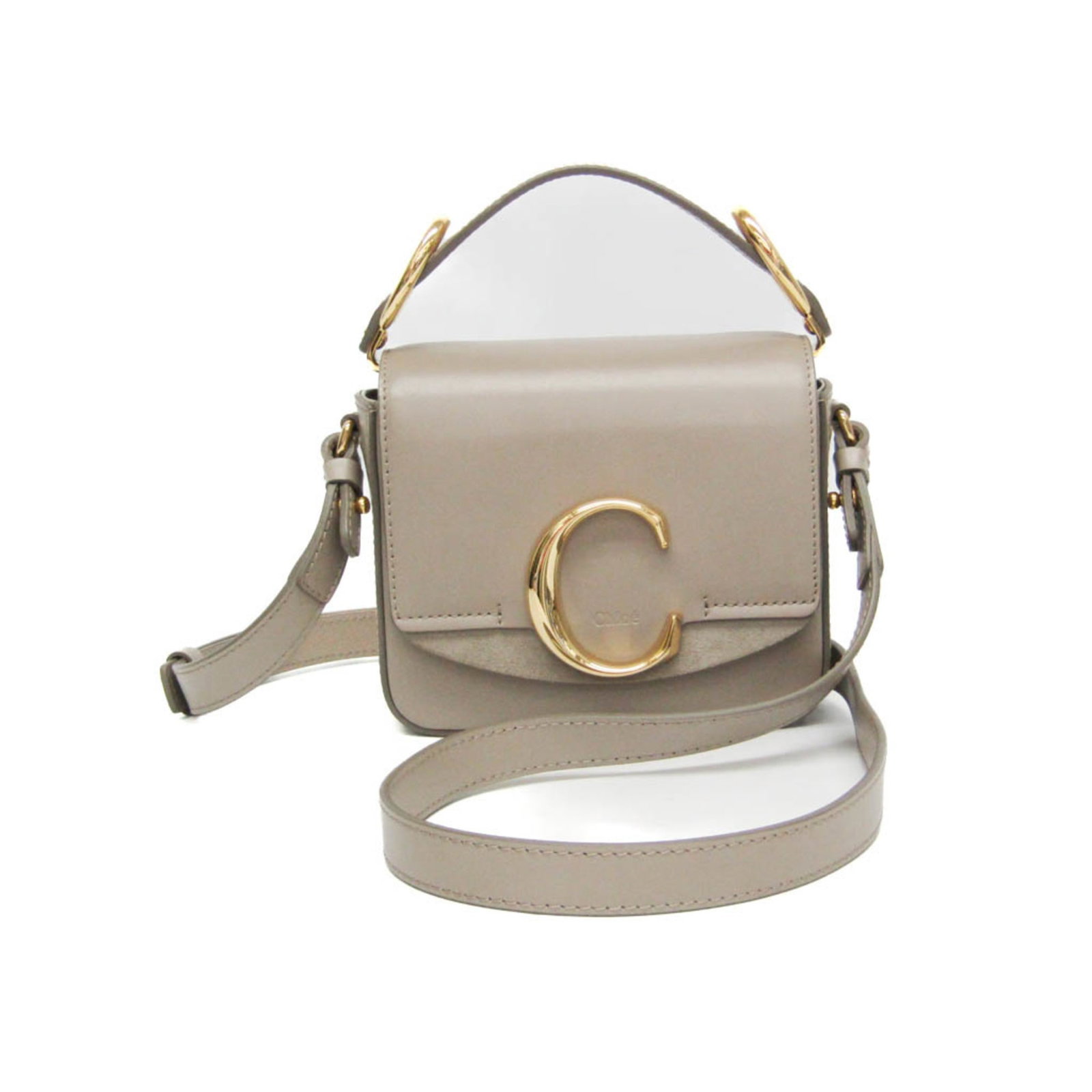 Chlo Handbag Shoulder Bag Leather Suede: Chlo Handbag Shoulder Bag Leather Suede Chlo Handbag Shoulder Bag Leather Suede features a sleek design with a grayish color, suede material, and a push lock closure. The bag boasts an open pocket