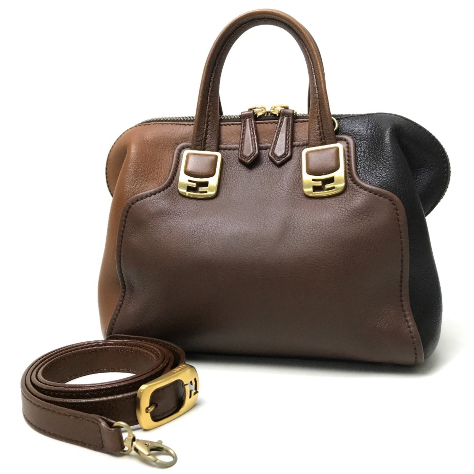 Handbag Leather Fendi: Handbag Leather Fendi Fendi's iconic handbag boasts a rich brown leather exterior, measuring 20.5cm x 27cm x 12cm, with a 9.4inch handle and shoulder strap that reaches 43.7inch. The bag's sleek desig