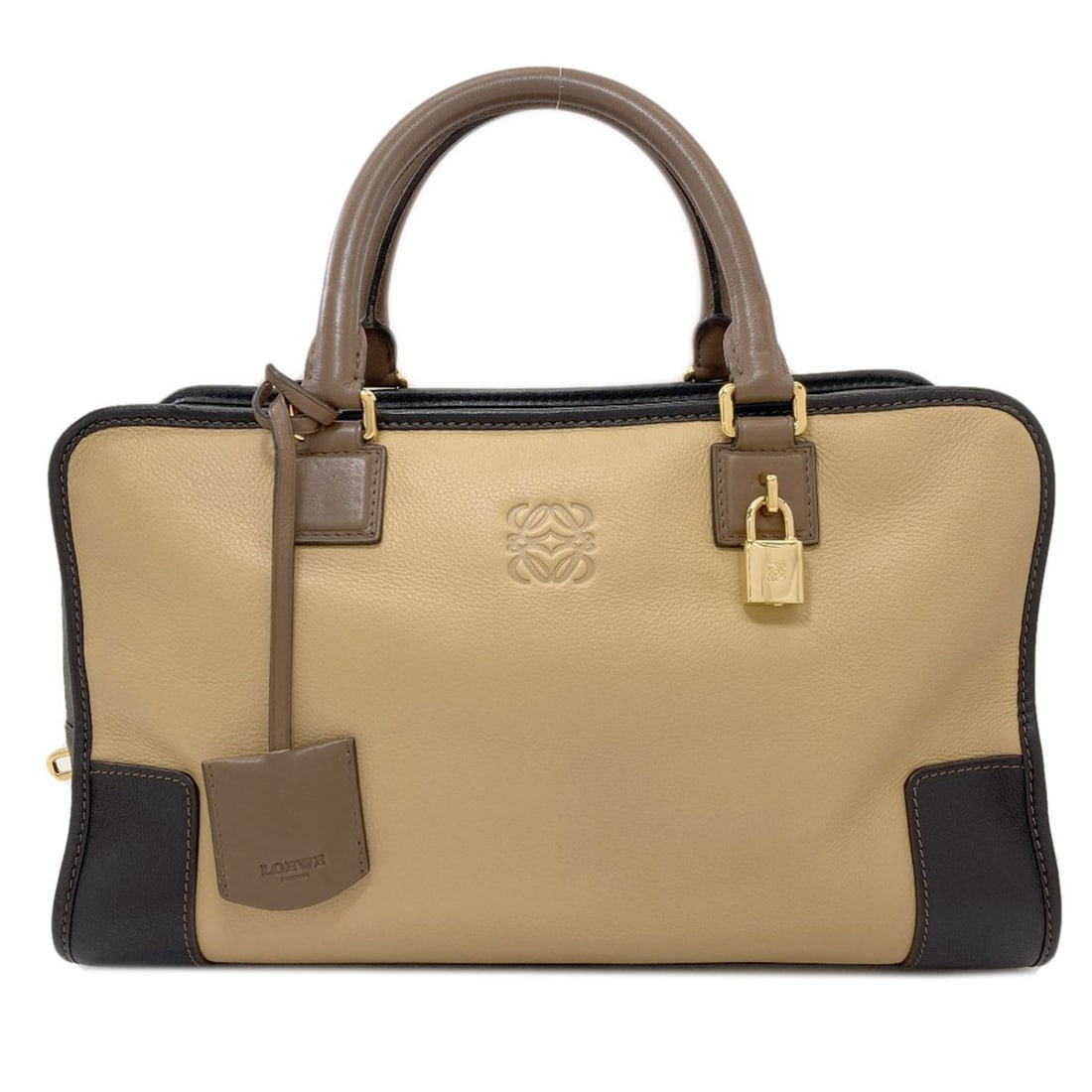Lambskin Handbag Loewe Amazona: Lambskin Handbag Loewe Amazona Lambskin Handbag Loewe Amazona is made from high-quality lambskin, a luxurious and durable material. The beige exterior of this handbag features a classic design, while