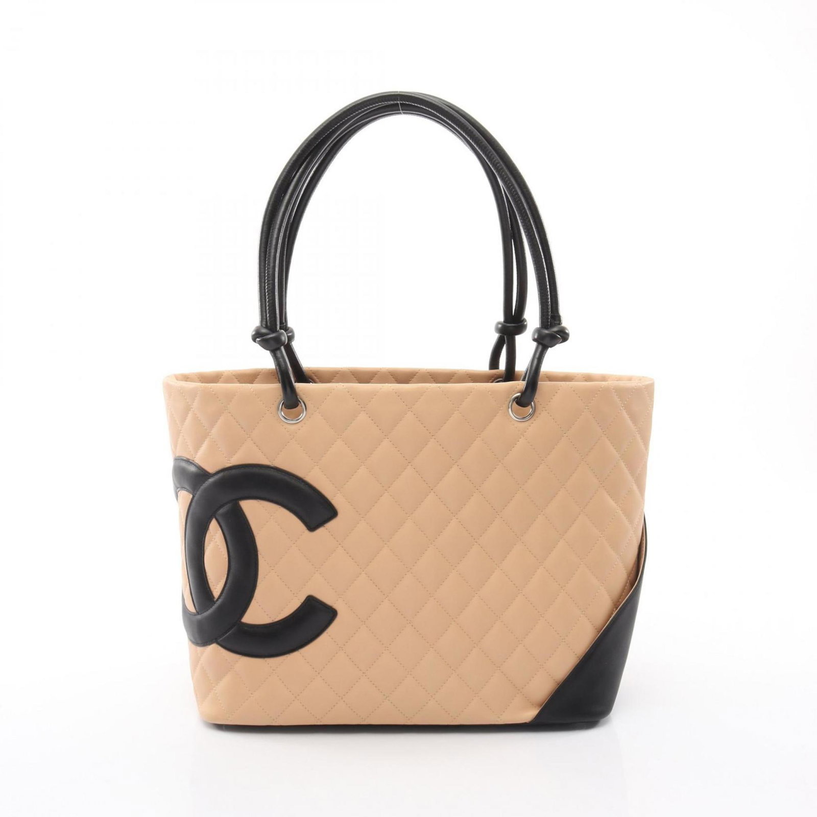 Chanel Handbag Leather Tote: Chanel Handbag Leather Tote Chanel Handbag Leather Tote in Beige and Black. This luxurious tote bag features high-quality leather construction and a classic design. With its timeless style and