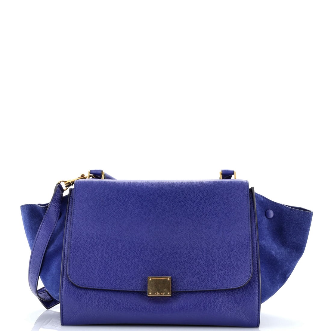 Medium leather Trapeze bag Celine: Medium leather Trapeze bag Celine Blue Celine Medium Leather Trapeze Bag with Suede Interior. This medium leather Trapeze bag features exposed piping, heavy scuffs, and cracking throughout, adding a w