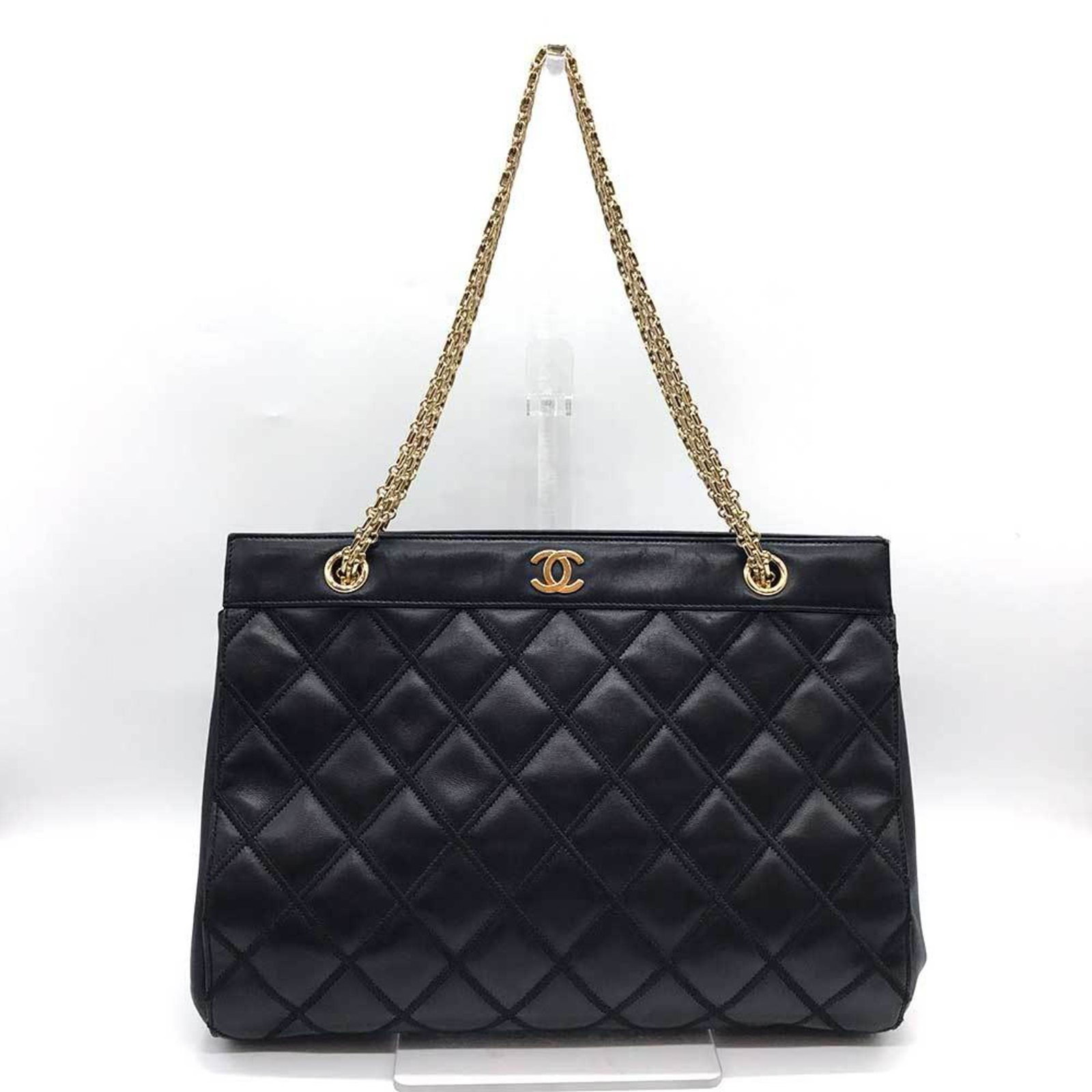 Leather Chanel Tote Bag: Leather Chanel Tote Bag Black leather Chanel tote bag with dimensions 25cm x 33.5cm x 13.5cm. This bag features genuine leather construction and comes with a guarantee card. A classic design from a
