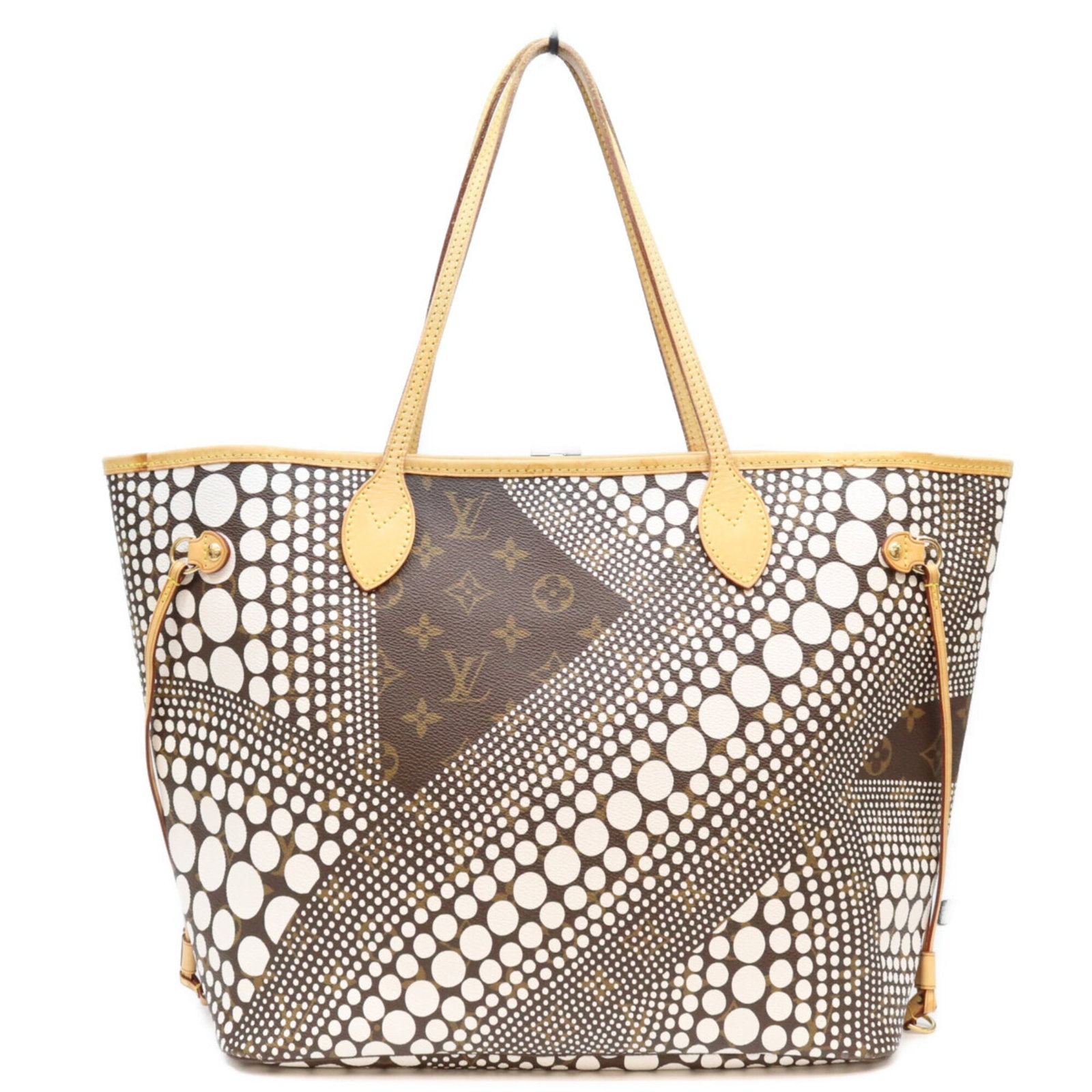 Louis Vuitton Monogram Tote: Louis Vuitton Monogram Tote Brown and white monogram pattern adorns this classic Louis Vuitton tote bag, adding a touch of timeless elegance to any outfit. Made from high-quality materials, the bag's 