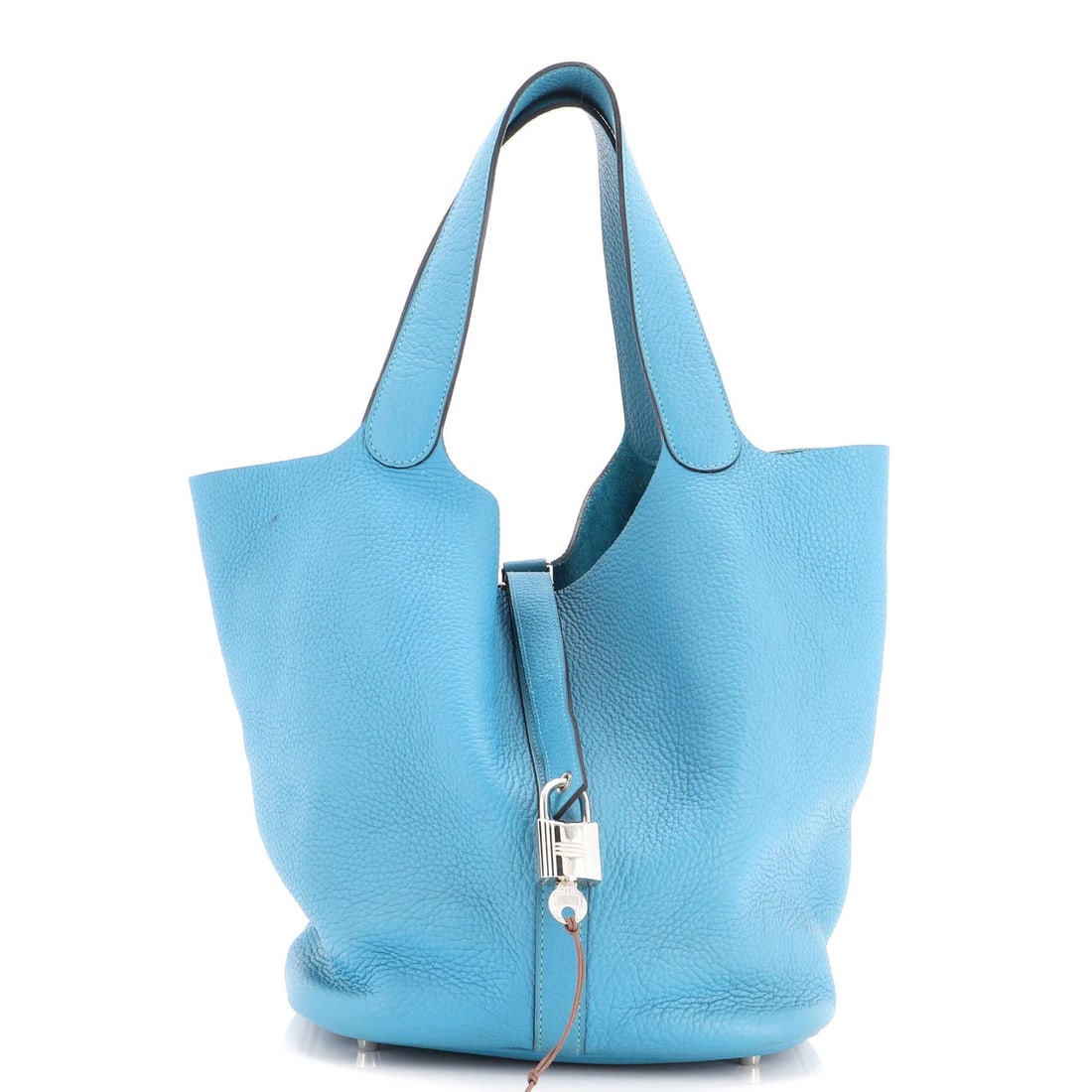 Clemence GM Lock Picotin Hermes Bag: Clemence GM Lock Picotin Hermes Bag The Clemence GM Lock Picotin Hermes Bag boasts a striking blue exterior, complemented by raw leather interior, and features a Palladium hardware accent. This
