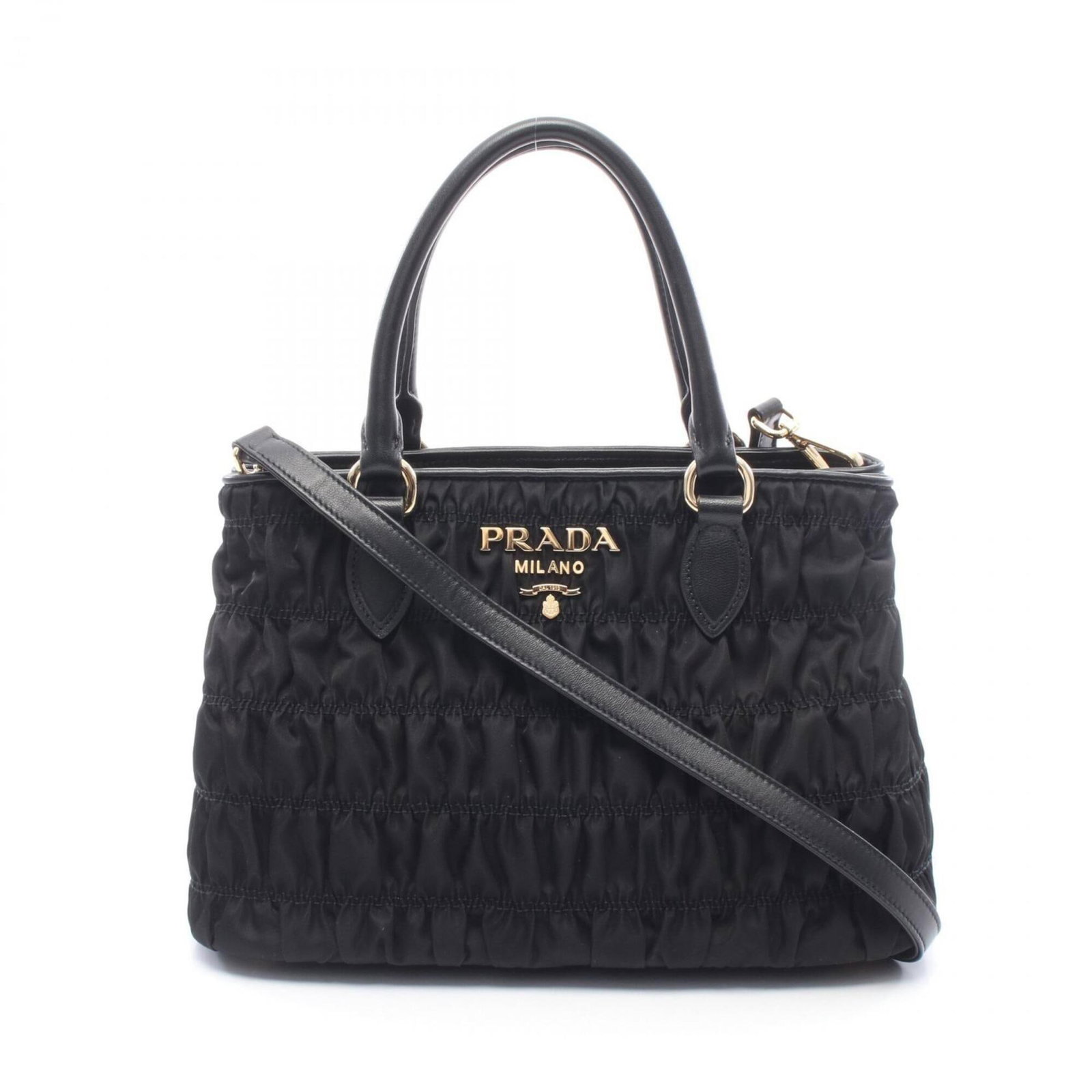 Nylon Leather Tote Prada Handbag: Nylon Leather Tote Prada Handbag Nylon Leather Tote Prada Handbag is made from a combination of nylon and leather materials, featuring a black color and dimensions of 20cm x 30cm x 14.5cm. The bag's