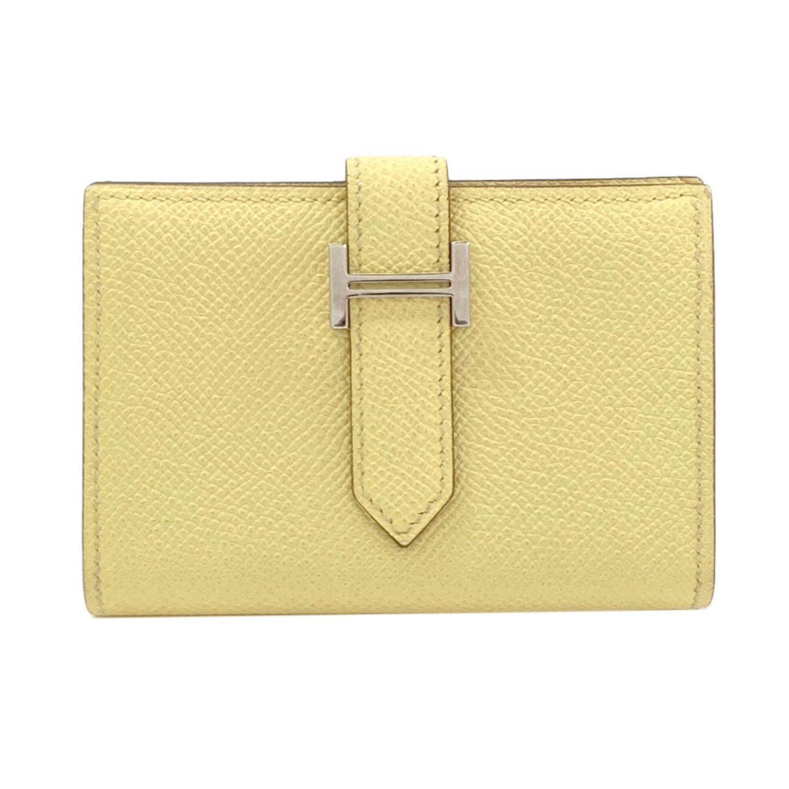 Hermes Coin Purse/ Coin Case Epsom Leather: Hermes Coin Purse/ Coin Case Epsom Leather Epsom leather craftsmanship shines in this yellow coin purse/coin case from Hermes, featuring a compact 7cm x 10cm x 1.5cm design that fits neatly in a purse