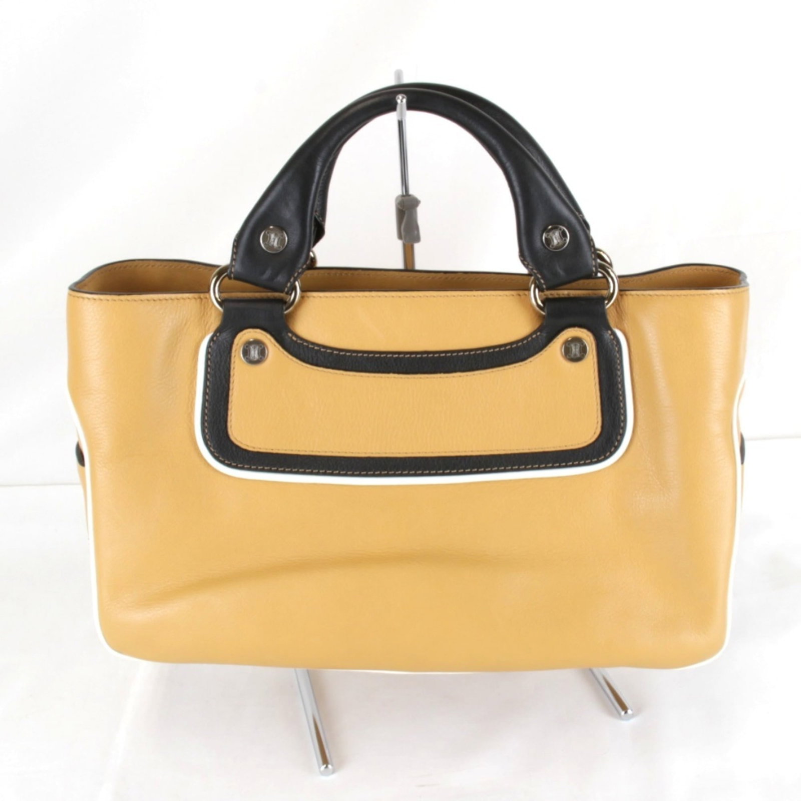 Celine Handbag Leather: Celine Handbag Leather Brown Celine Handbag Leather is made from high-quality leather, featuring a classic design with two open pockets and a zipper pocket. The bag measures 19cm x 35cm x 14cm and