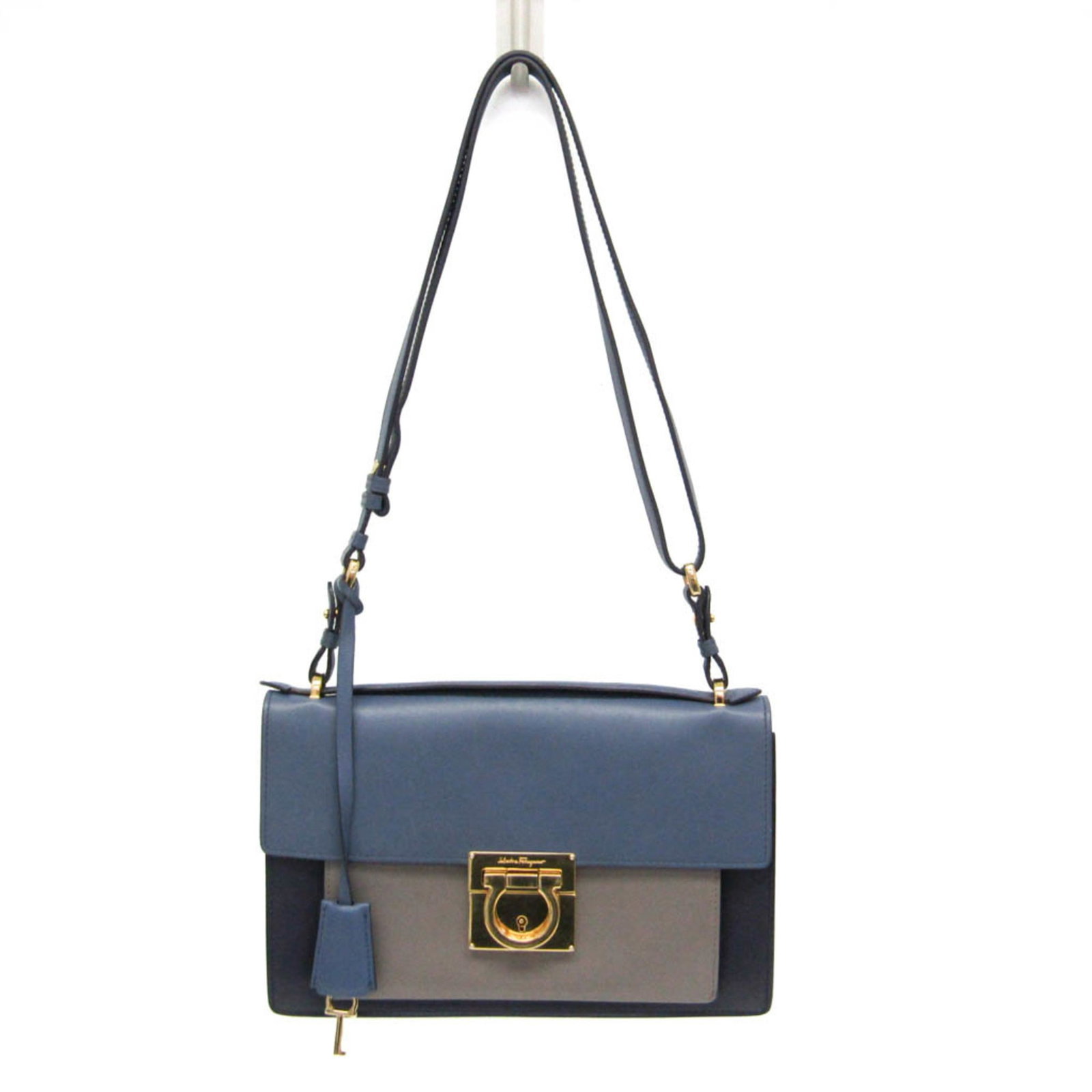 Ferragamo Salvatore Handbag Leather Bag Shoulder: Ferragamo Salvatore Handbag Leather Bag Shoulder The Salvatore Ferragamo Gancini AB-21 handbag is a stylish shoulder bag crafted from high-quality leather. Featuring a sleek blue and gray color