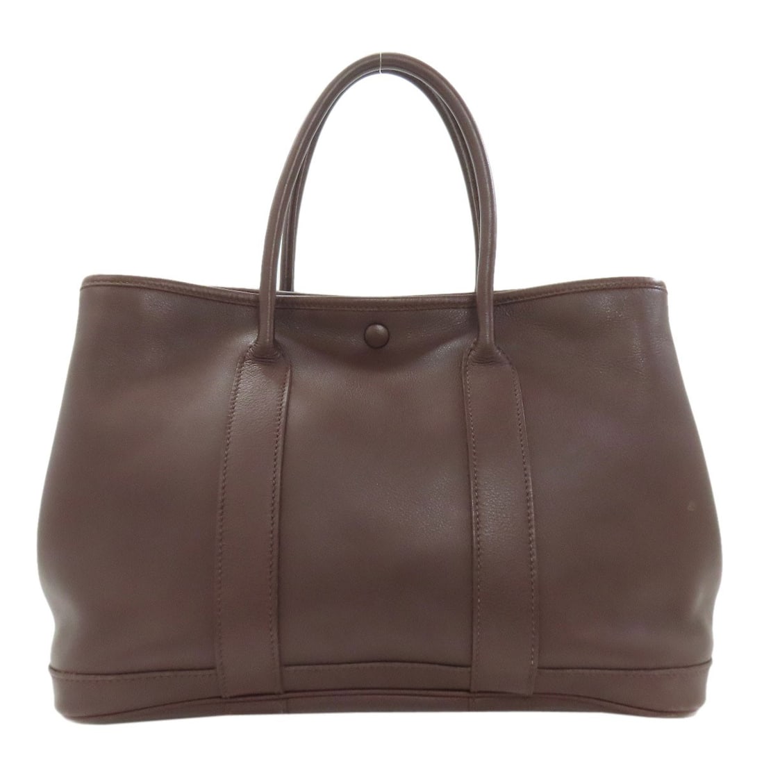 Handbag Havana Twilly Garden Swift Hermes Tpm: Handbag Havana Twilly Garden Swift Hermes Tpm Swift Swift Swift is a material used in the exterior of this handbag, giving it a unique look and feel. The handbag's brown color and swift exterior