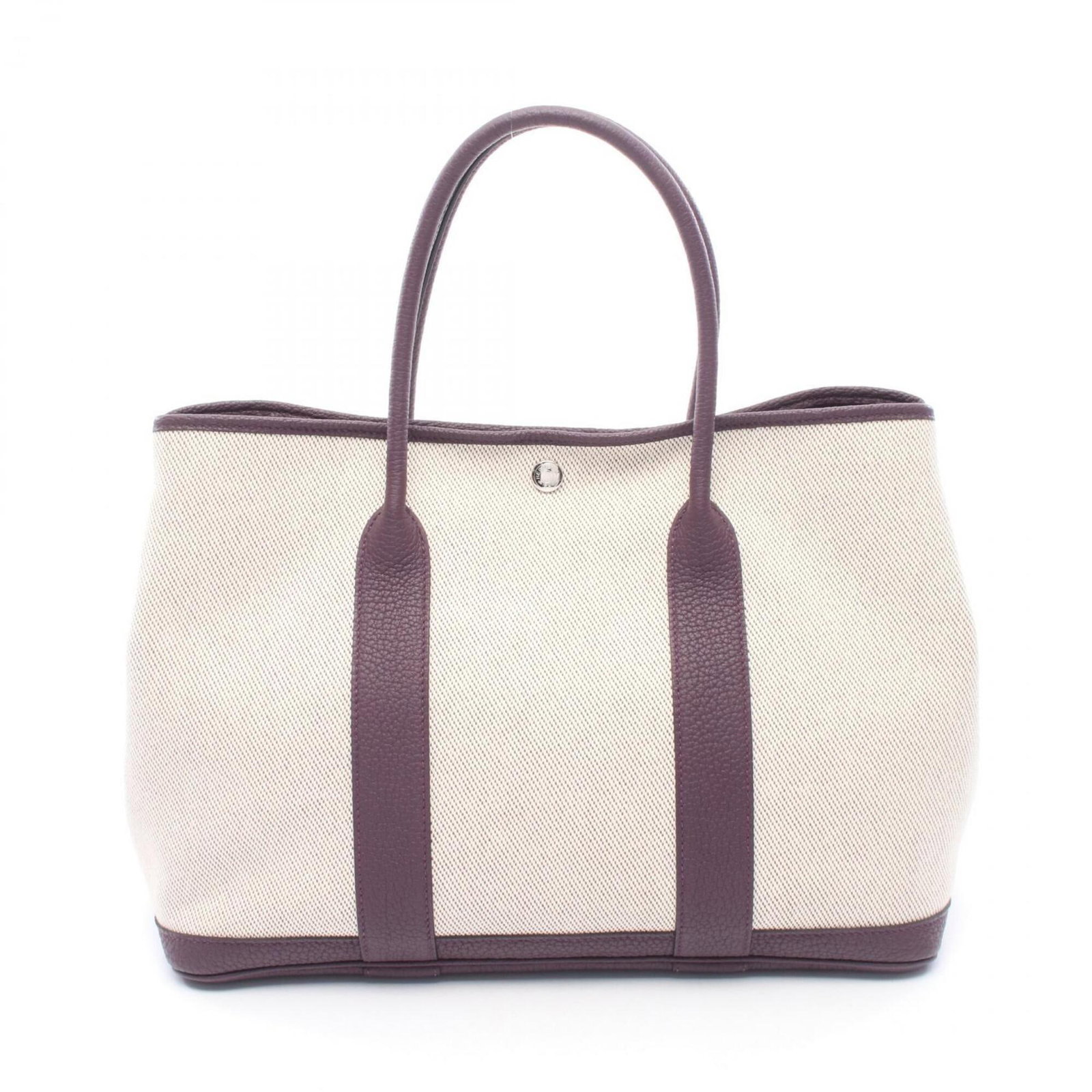 Hermes Canvas Leather Handbag Tote: Hermes Canvas Leather Handbag Tote Canvas and leather come together in this elegant tote bag from Hermes, featuring a classic beige and purple color combination. Measuring 25cm x 36cm x 17cm, it's