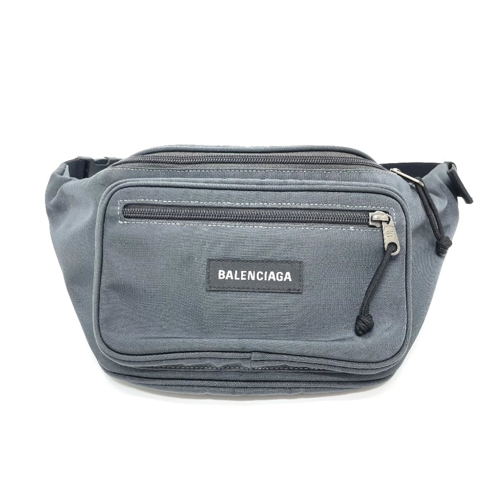 Balenciaga Other Cloth: Balenciaga Other Cloth The Balenciaga Other Cloth is a unique piece featuring a gray nylon part and an adjustable black shoulder part. Its compact size, measuring 40.5cm x 21cm x 8cm, makes it a