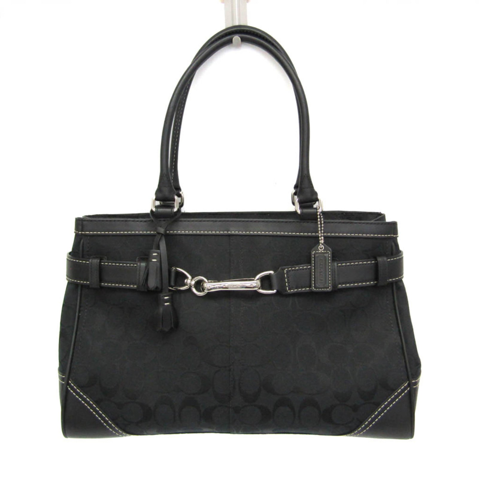 Canvas Leather Coach Tote Shoulder Bag: Canvas Leather Coach Tote Shoulder Bag Canvas Leather Coach Tote Shoulder Bag. This black canvas leather tote features a classic design with a zipper closure, two pockets, and a spacious interior.