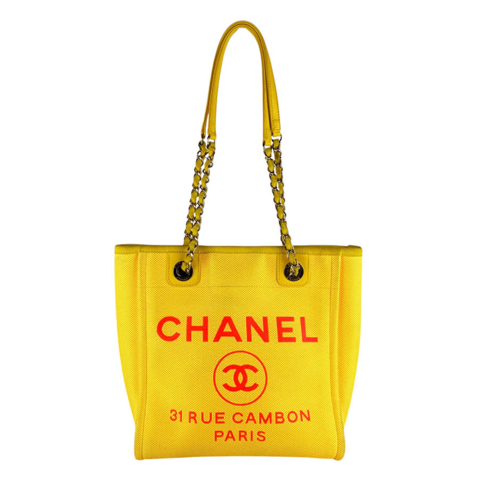 Handbag Canvas by Chanel: Handbag Canvas by Chanel Canvas by Chanel, a stylish handbag from Italy, boasts a vibrant pink and yellow color combination. Measuring 27cm x 30cm x 9cm, this canvas bag is a compact and chic