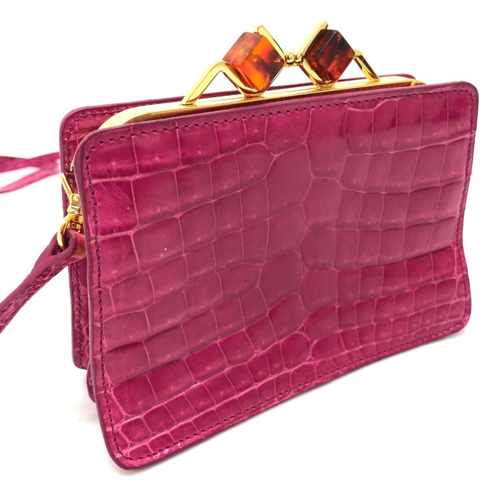 Shoulder Bag Leather: Shoulder Bag Leather Pink leather shoulder bag with a compact size of 15.5cm x 10cm x 5cm, featuring a stylish design that fits perfectly in any handbag collection. The bag's signature pink color