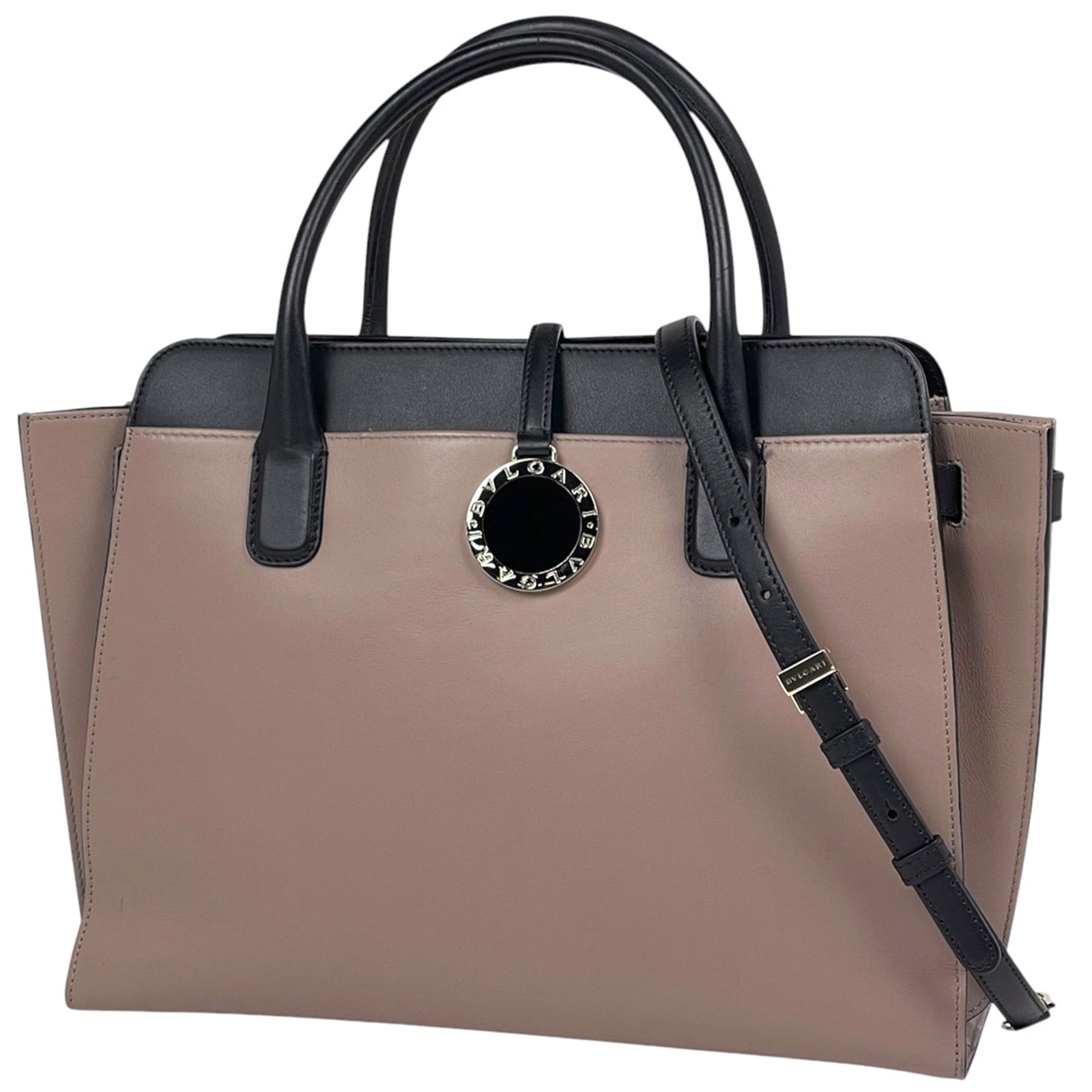 Bvlgari Tote Bag Leather: Bvlgari Tote Bag Leather Bvlgari's iconic tote bag is crafted from high-quality leather, available in two timeless colors: beige and black. The bag's classic design and sleek silhouette make it a