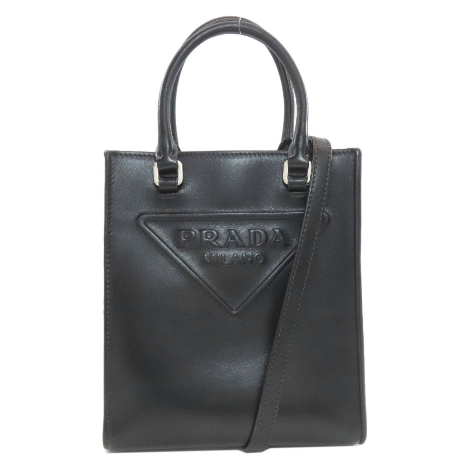 Handbag Leather Prada: Handbag Leather Prada Black leather Prada handbag with dimensions 19cm x 16.5cm x 6cm. Made from high-quality leather, this stylish bag features a sleek design and a compact size. A notable aspect of 