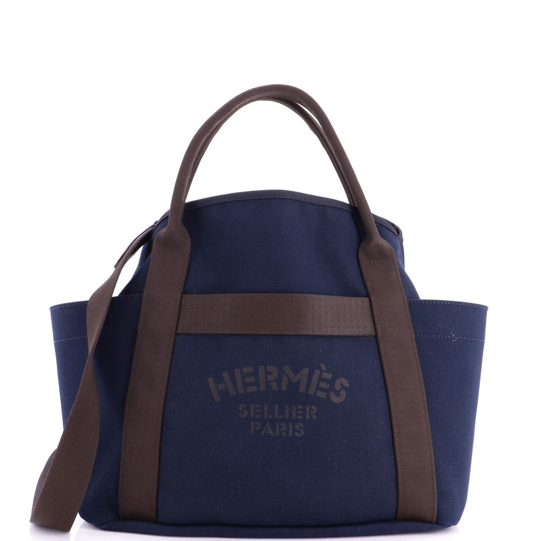 Handbag Canvas Hermes Sac Groom Pansage: Handbag Canvas Hermes Sac Groom Pansage Canvas Sac Groom Pansage Handbag from Hermes features a striking blue canvas exterior with a contrasting orange interior. The bag's Palladium hardware adds a to