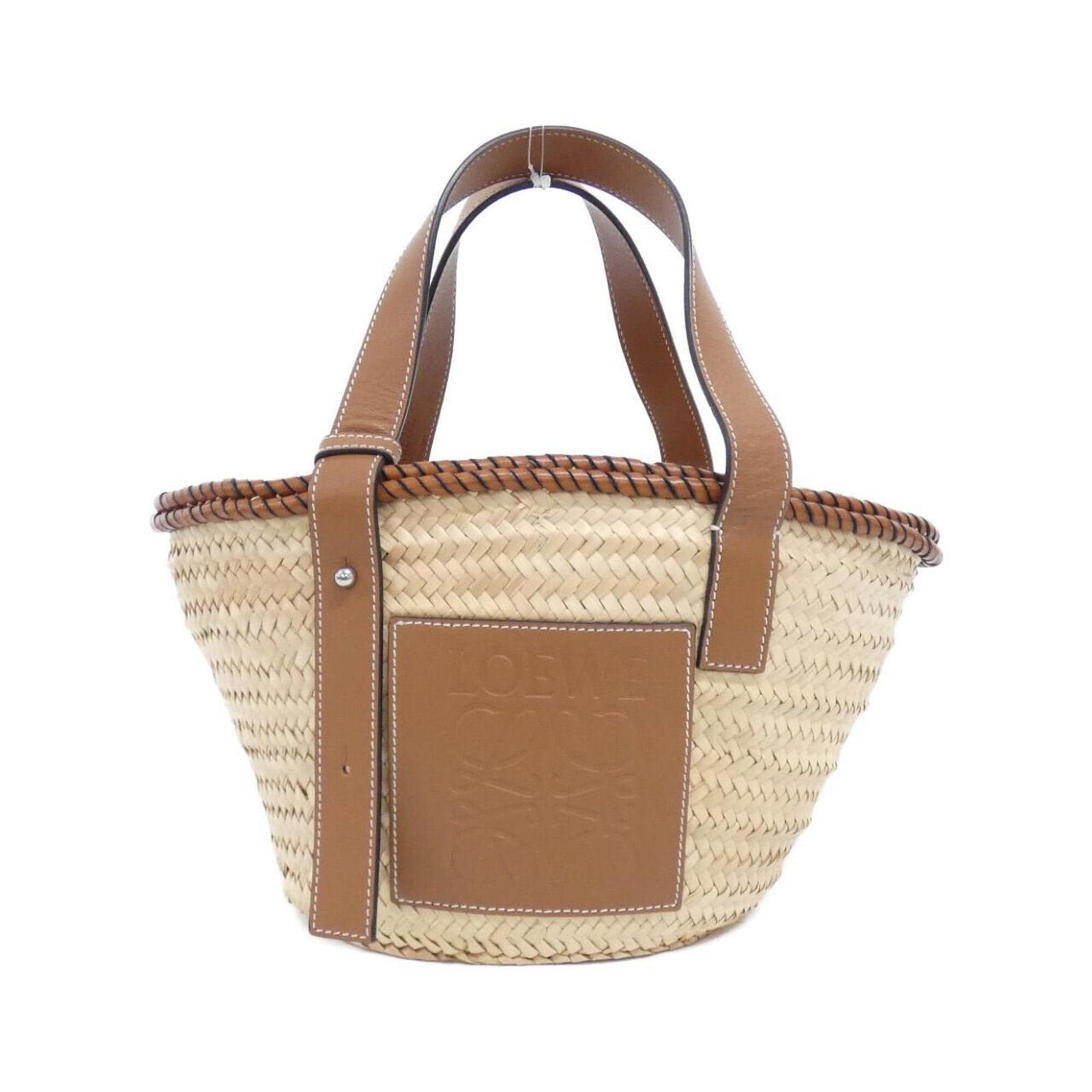 Handbag Loewe Raffia: Handbag Loewe Raffia The Loewe Raffia handbag boasts a unique and stylish design, featuring a beige color and a signature that bears a mark of authenticity. Made from high-quality raffia material,