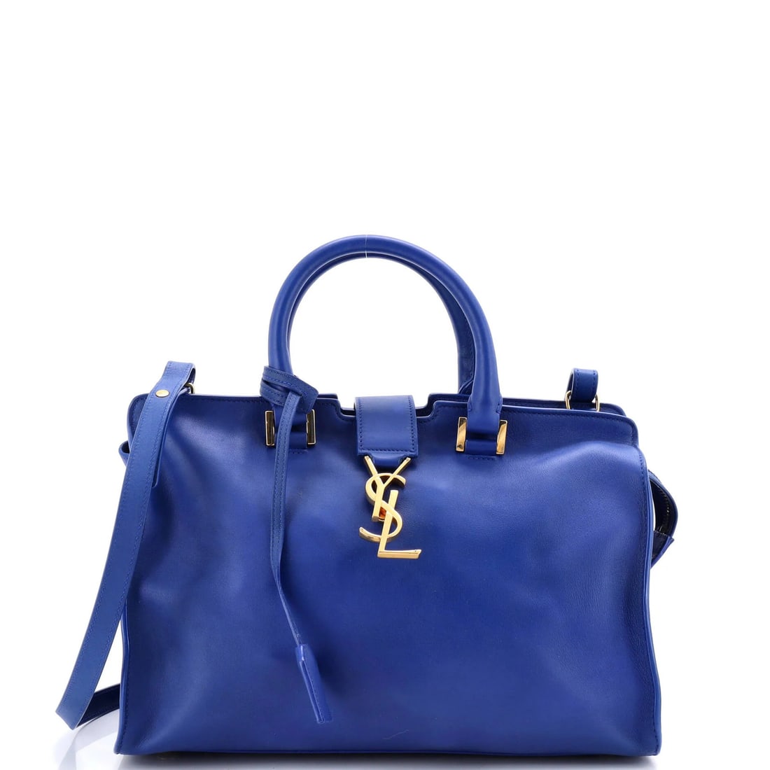 Cabas Leather Small Saint Monogram Laurent: Cabas Leather Small Saint Monogram Laurent Small Saint Monogram Cabas Leather Satchel in Blue features a classic design with a signature monogram logo, adorned with a gold clochette and adjustable