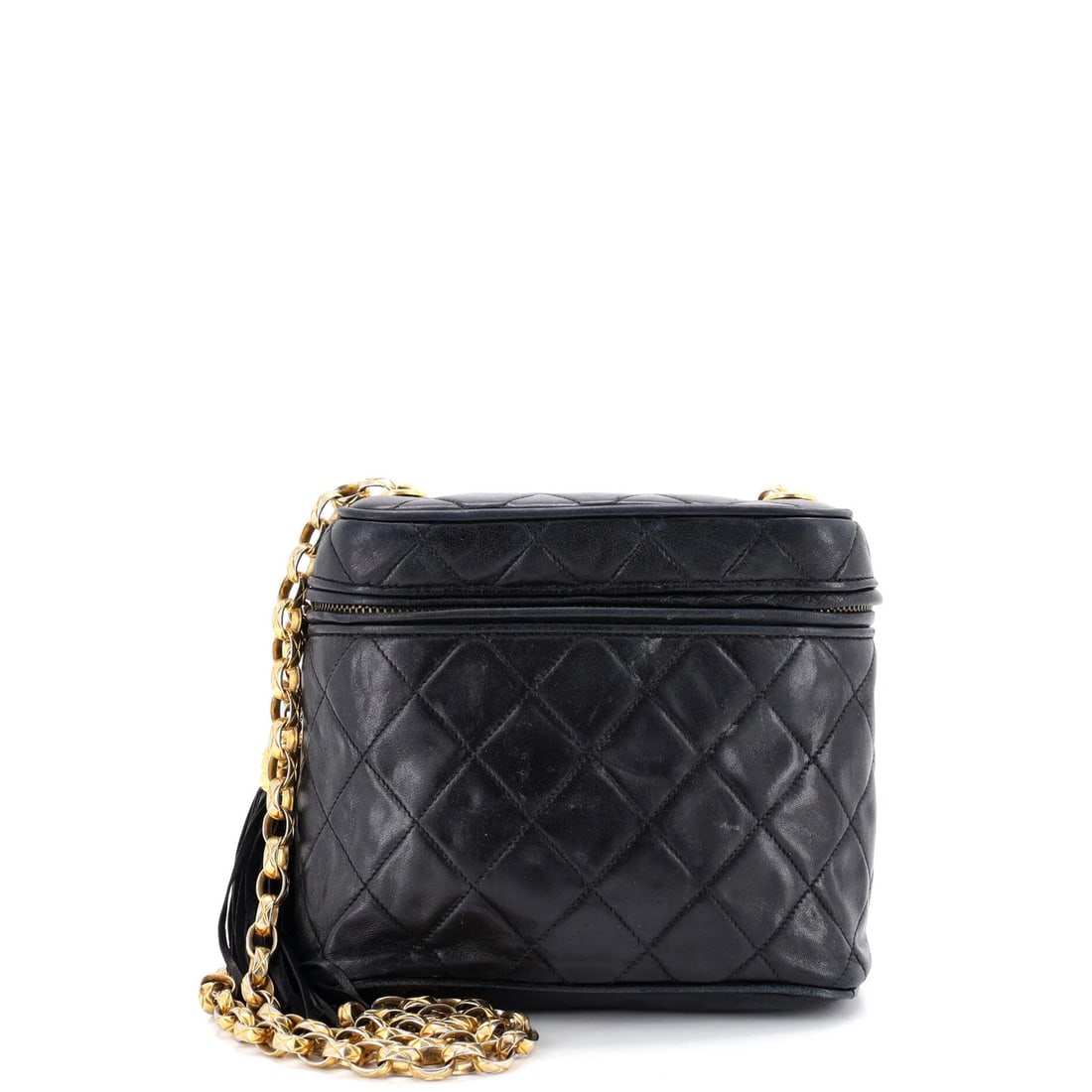 Lambskin Quilted Chanel Bag Vintage Zip Box: Lambskin Quilted Chanel Bag Vintage Zip Box This vintage Chanel bag boasts a striking quilted lambskin exterior in black, adorned with gold hardware and a classic box zip closure. The bag's fair