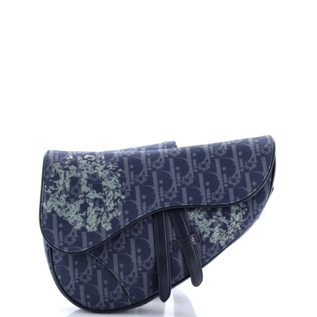 Christian Dior Saddle Oblique Canvas Denim Bag Tears Crossbody: Christian Dior Saddle Oblique Canvas Denim Bag Tears Crossbody The Christian Dior Saddle Oblique Canvas Denim Bag Tears Crossbody boasts a striking blue canvas exterior with a unique oblique design,