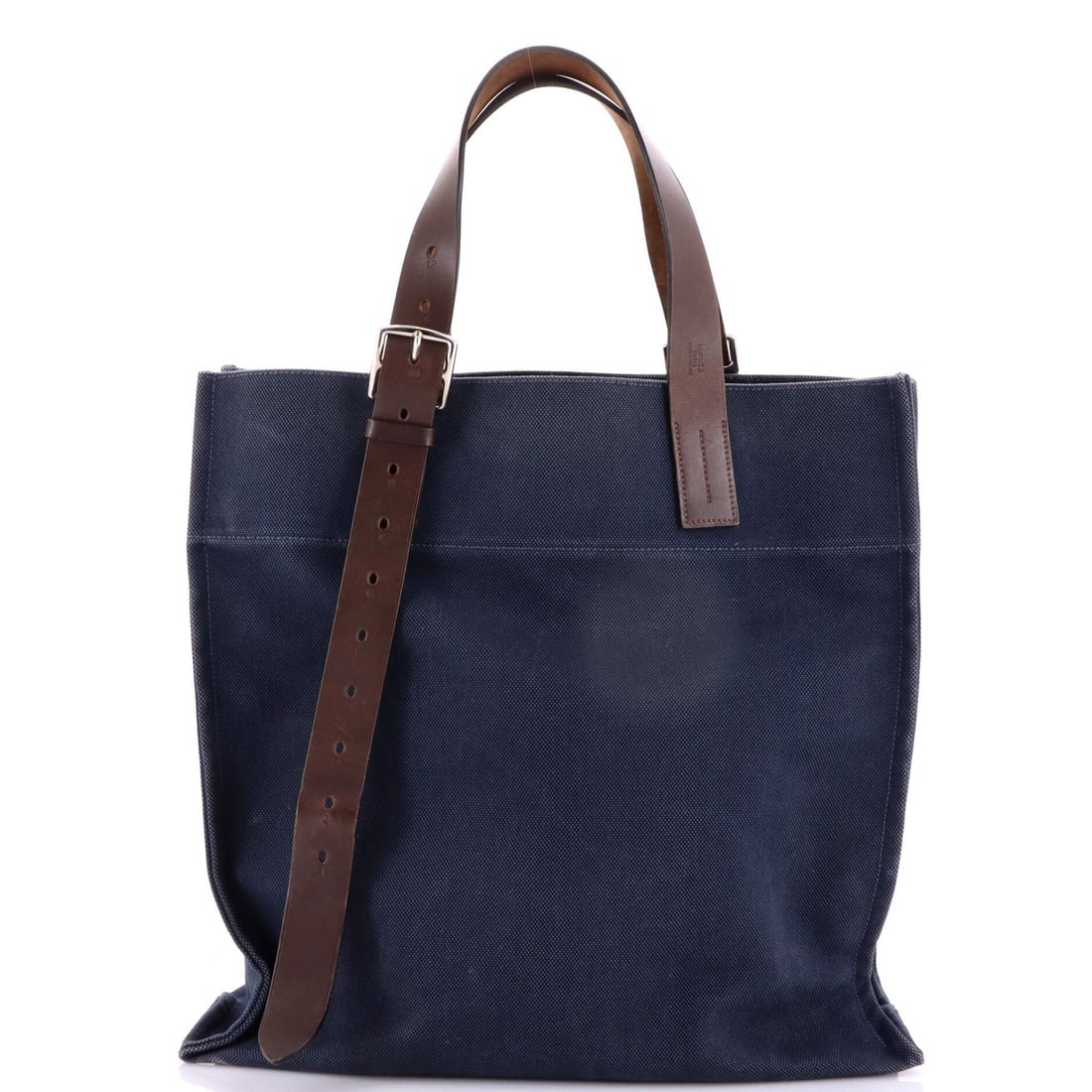 Tote Shopping Toile Leather Etriviere Hermes: Tote Shopping Toile Leather Etriviere Hermes Blue Etriviere Shopping Tote Toile and Leather, a Fair Condition Shopping Tote from Hermes, features a canvas and leather exterior with a blue interior.
