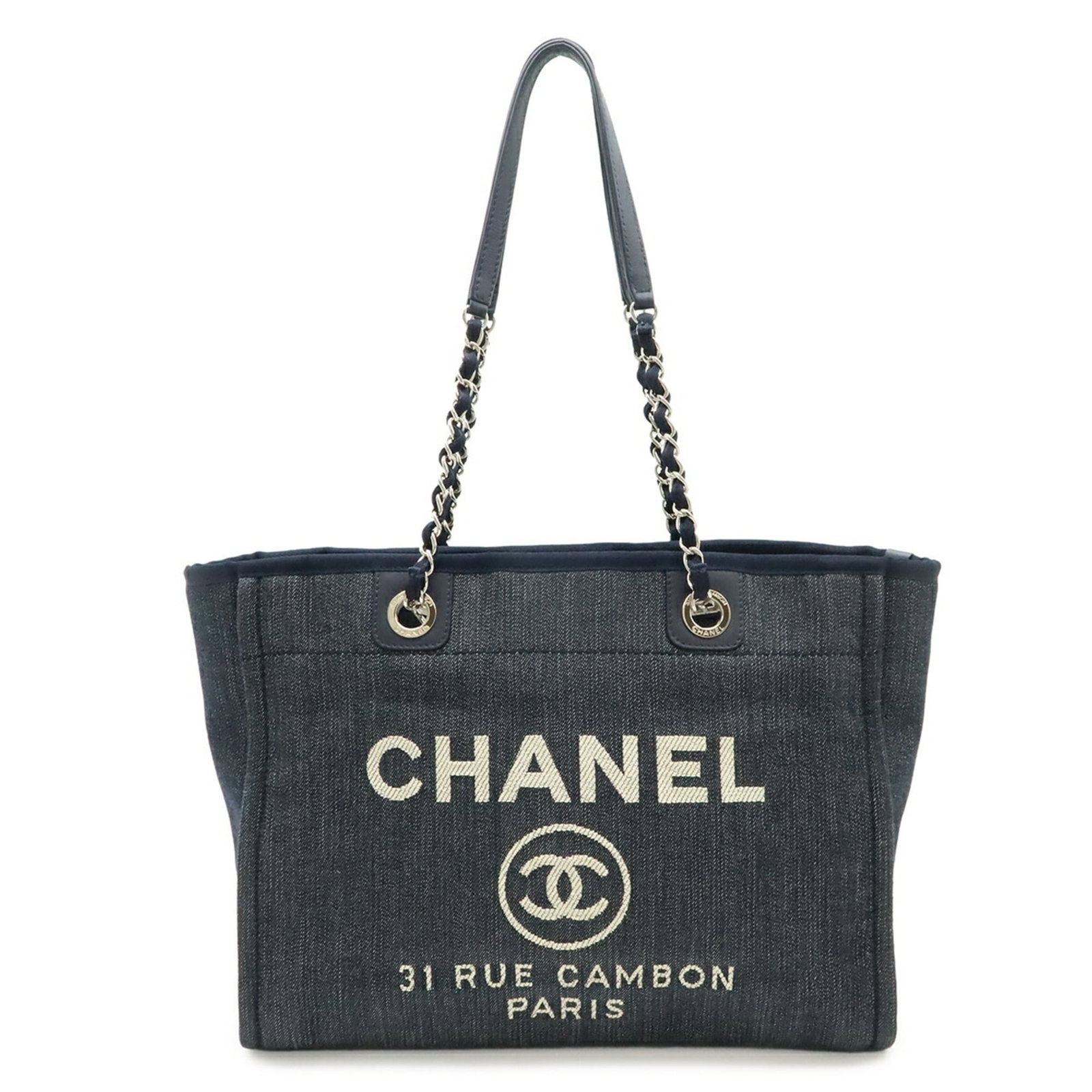 Leather Denim Tote Bag Chanel Shoulder: Leather Denim Tote Bag Chanel Shoulder Navy blue denim and leather combine in this sleek Chanel shoulder tote bag, measuring 26cm x 34cm x 13.5cm. The silver hardware adds a touch of sophistication, w
