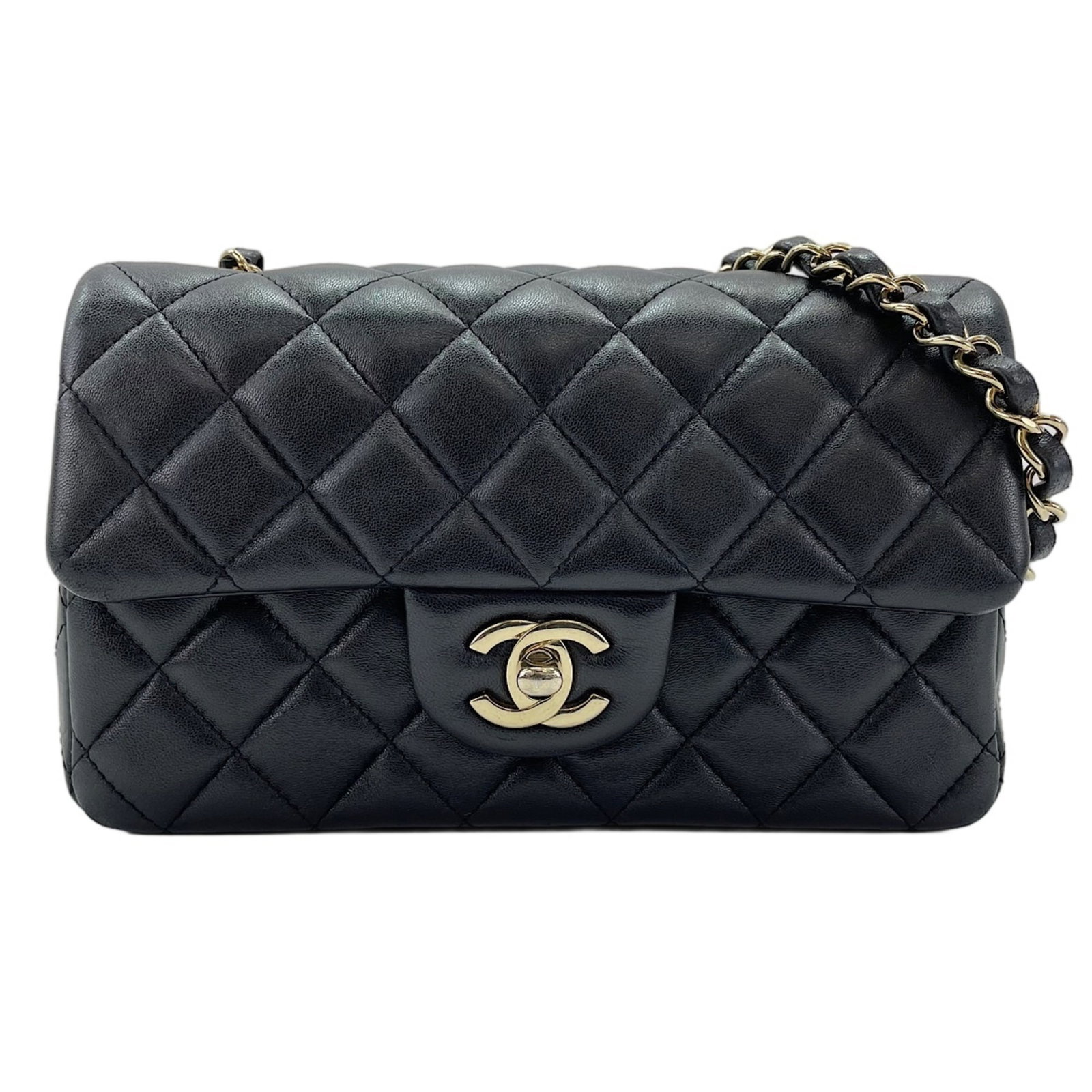 Shoulder Bag by Chanel: Shoulder Bag by Chanel The sleek and sophisticated Chanel shoulder bag boasts a timeless design, with clean lines and a classic black hue that exudes elegance. Measuring 12cm x 20cm x 6.5cm, this